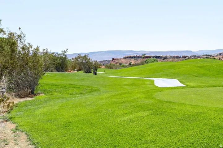 Surrounding community featuring a mountain view and view of golf course