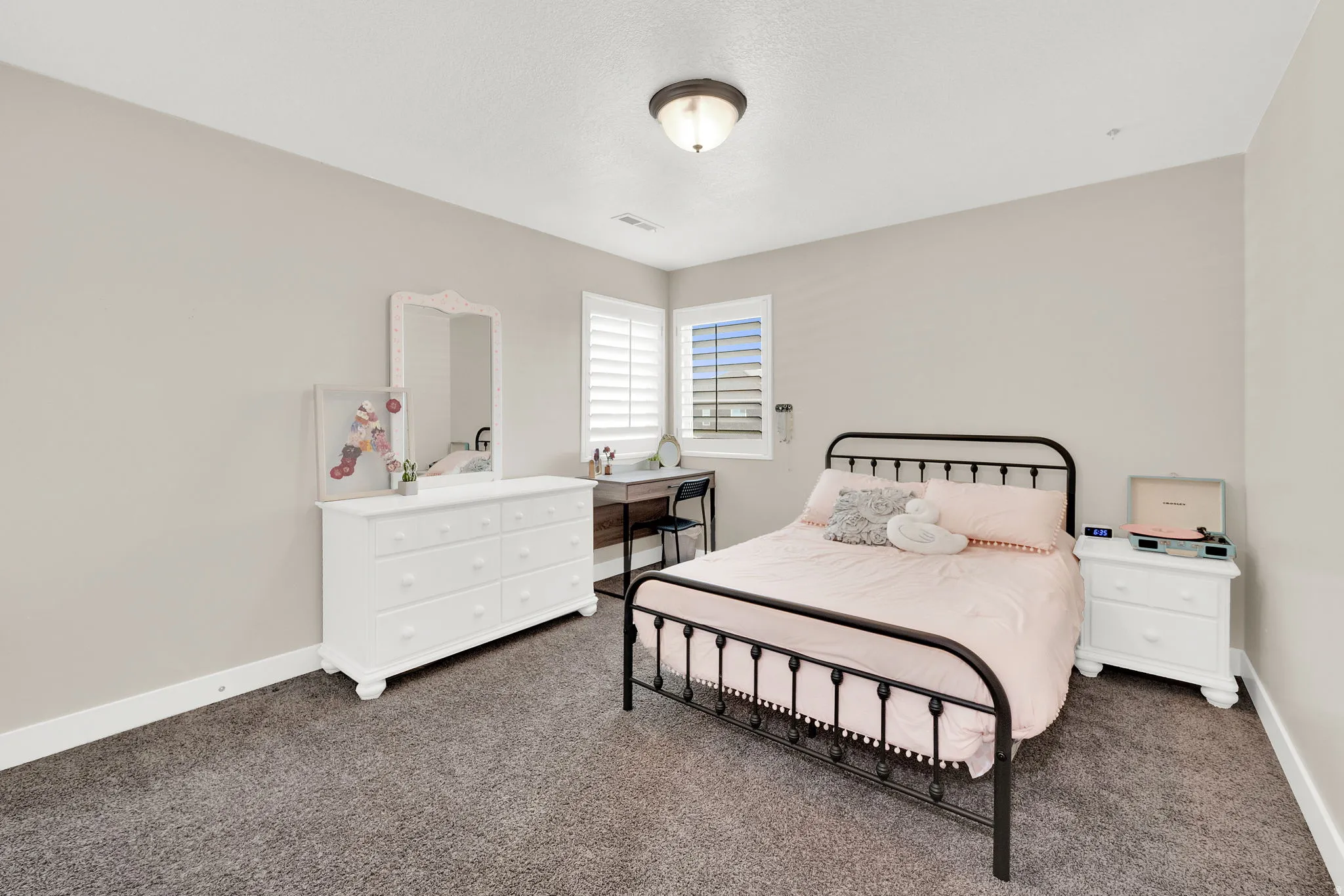 Bedroom featuring dark colored carpet