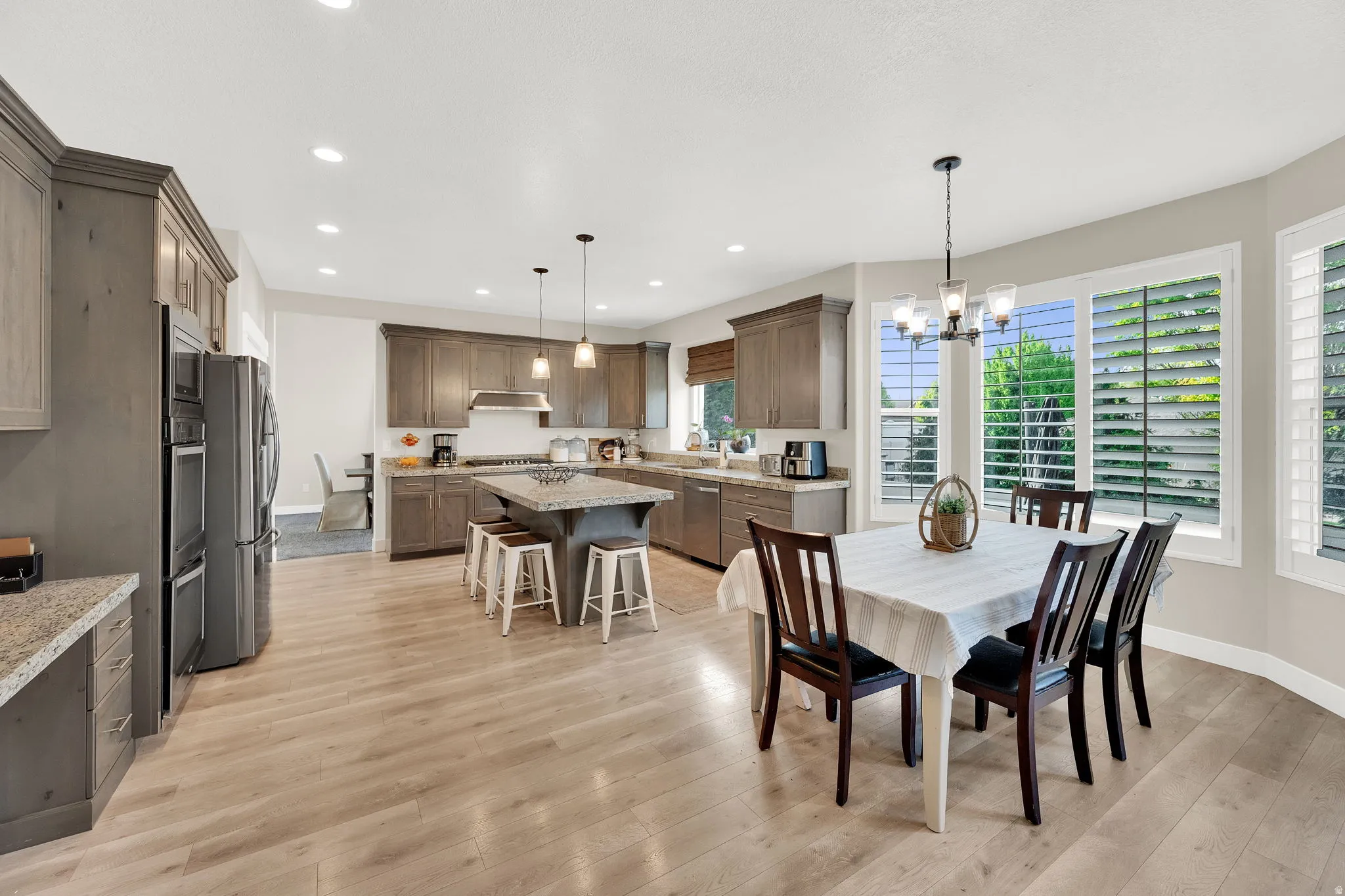Dining area with a chandelier and light wood-style floors