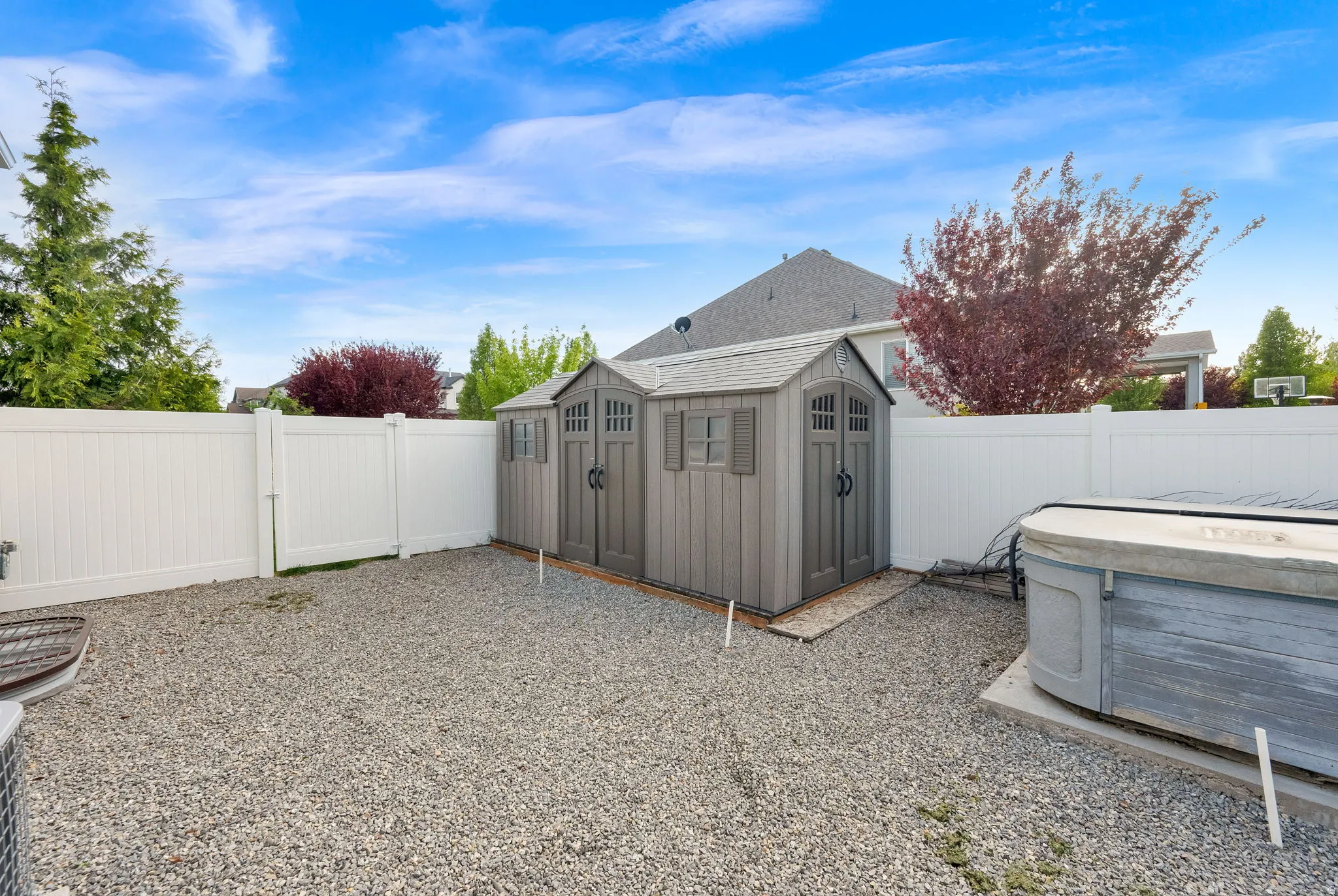 View of shed with a fenced backyard
