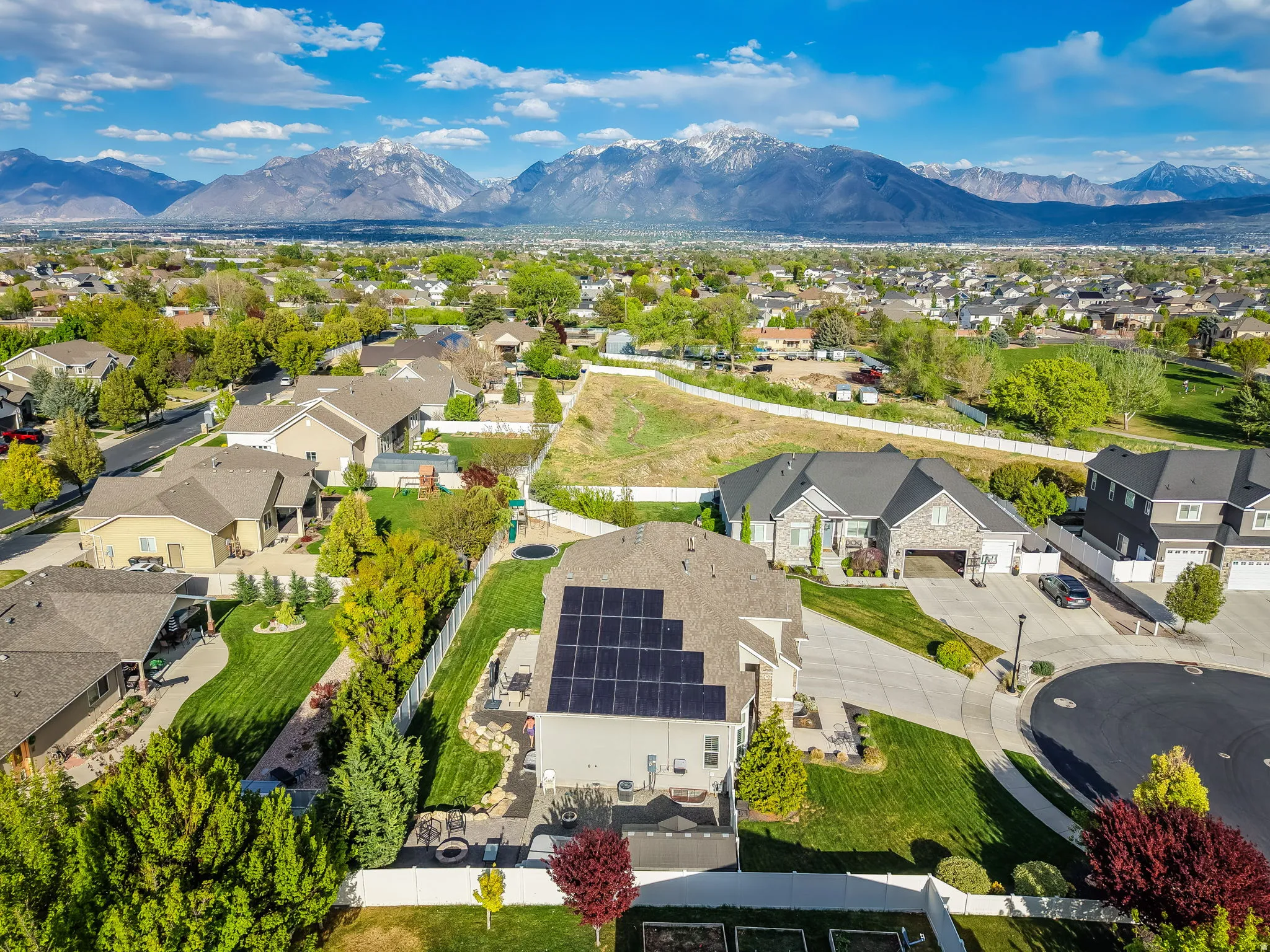 Aerial perspective of suburban area with a mountainous background