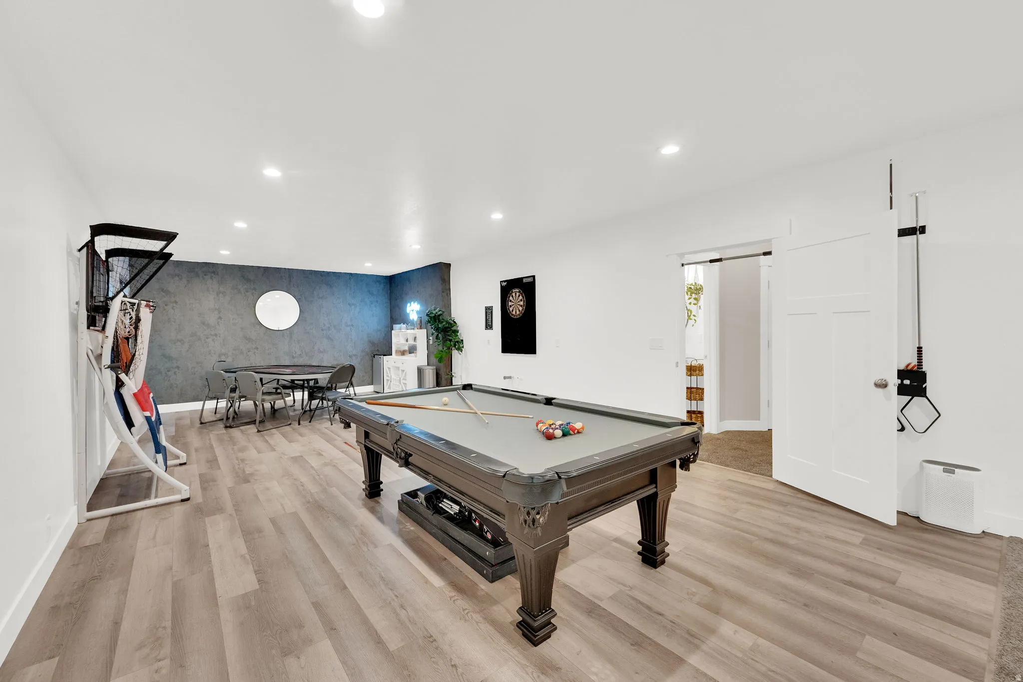 Recreation room with an accent wall, recessed lighting, light wood-type flooring, billiards, and wallpapered walls