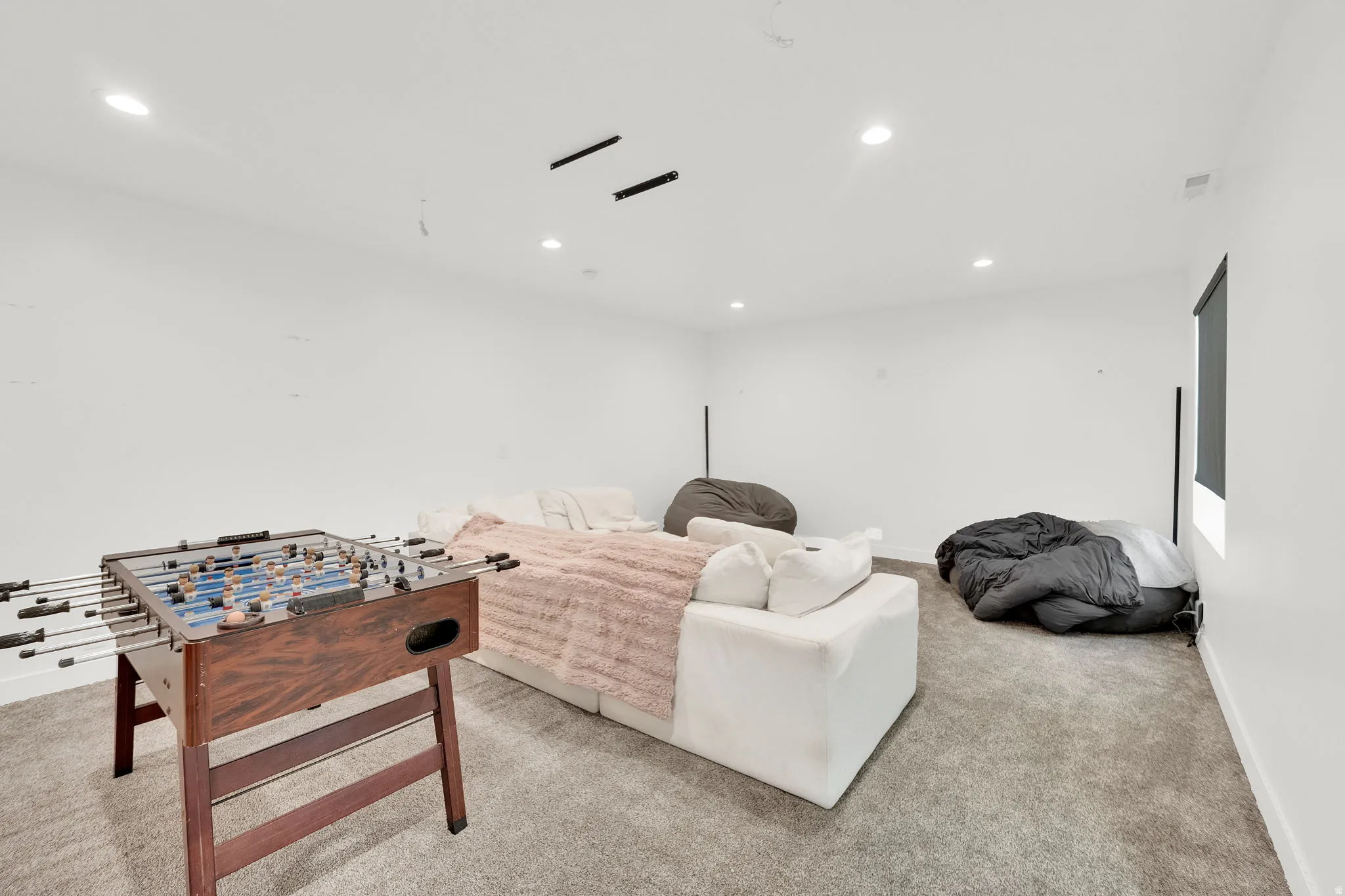 Game room featuring light carpet and recessed lighting
