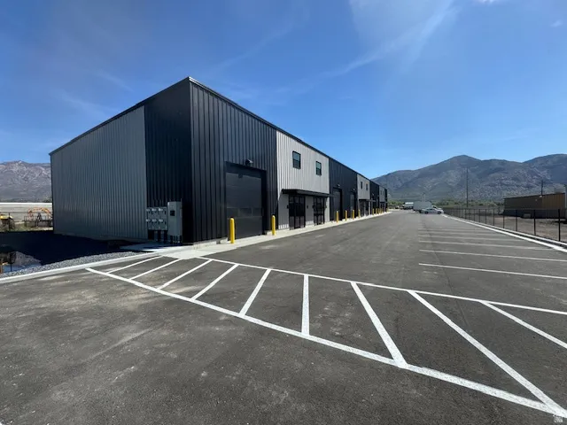 Uncovered parking lot featuring a mountain view