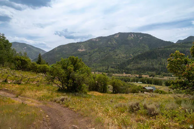 View of mountain backdrop featuring rural landscape