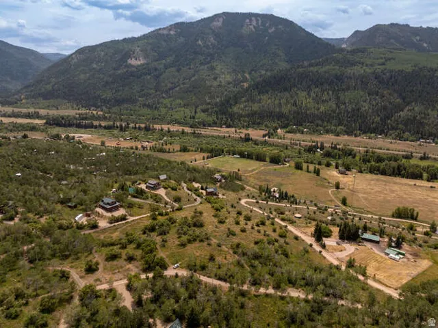 Aerial view of sparsely populated area with mountains