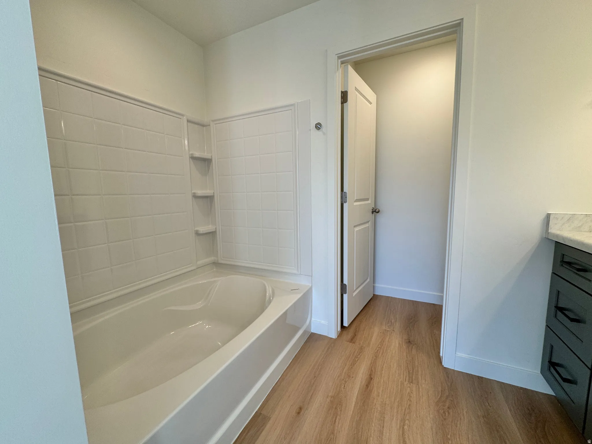 Bathroom with vanity and light wood-style floors