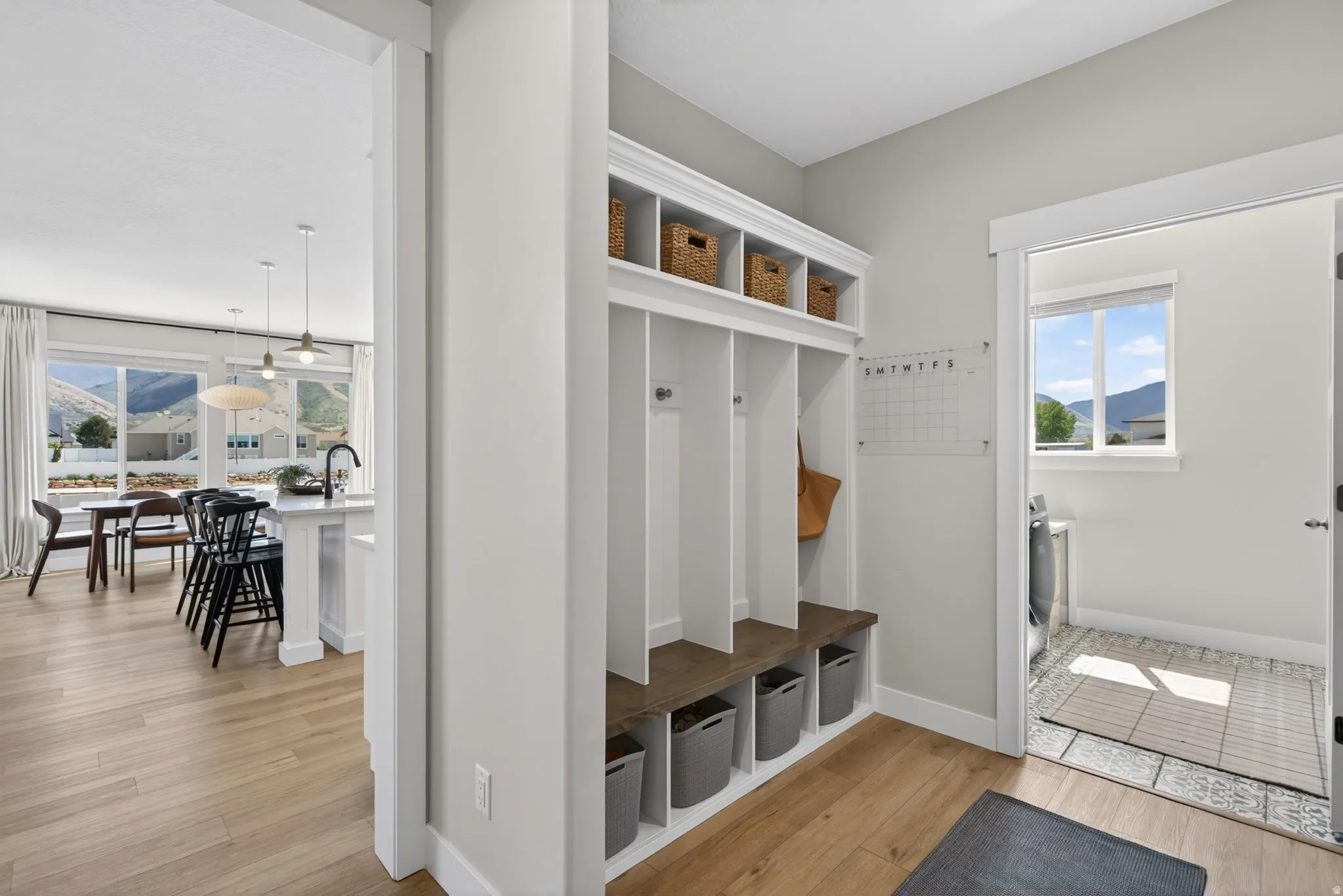 Mudroom featuring light wood-style floors and a mountain view