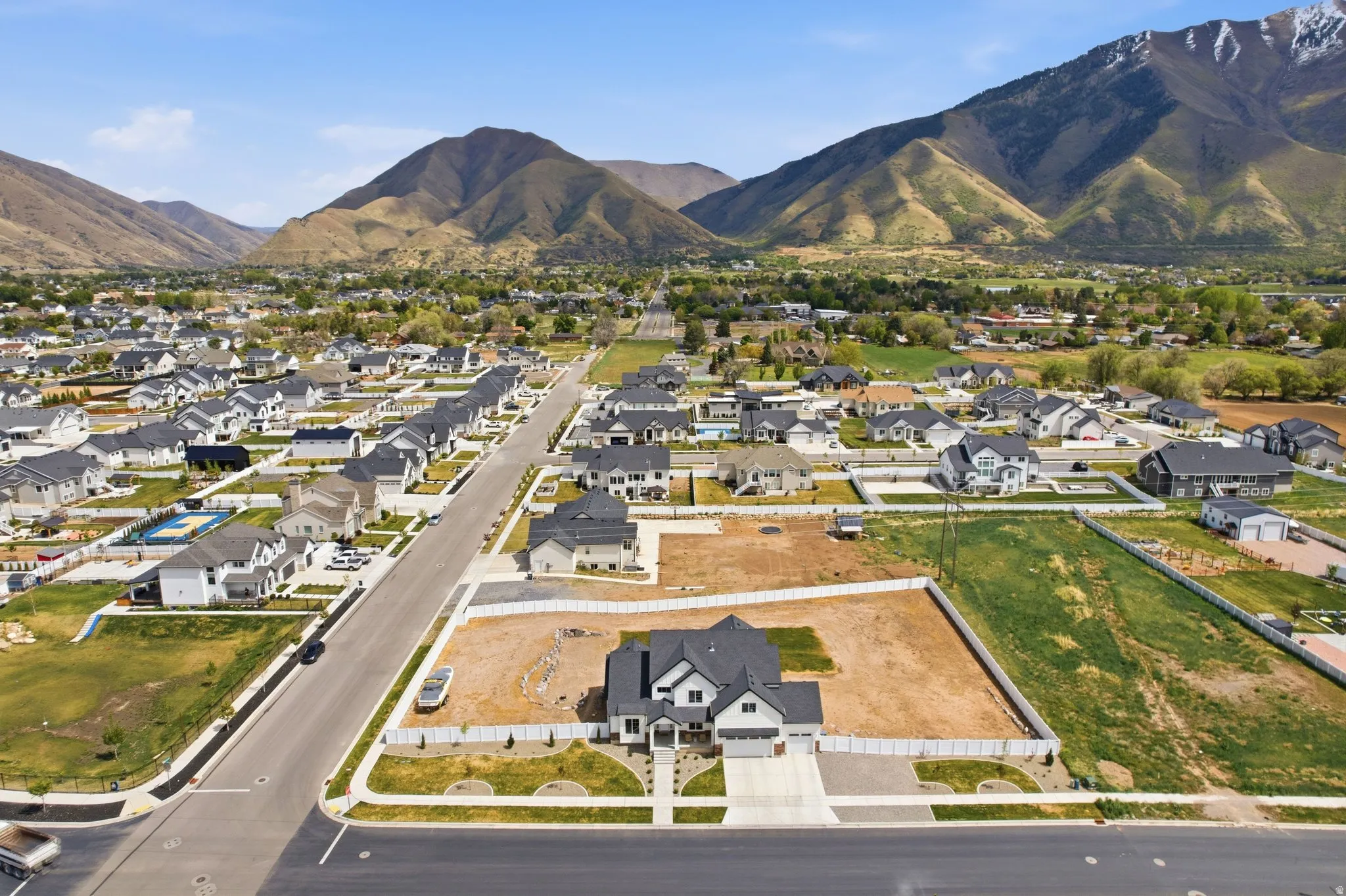 Aerial view of residential area featuring mountains
