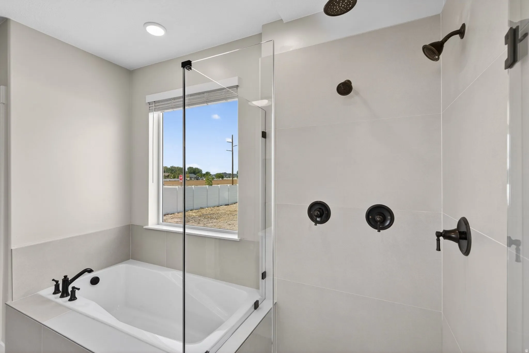 Full bathroom with a shower stall and a garden tub