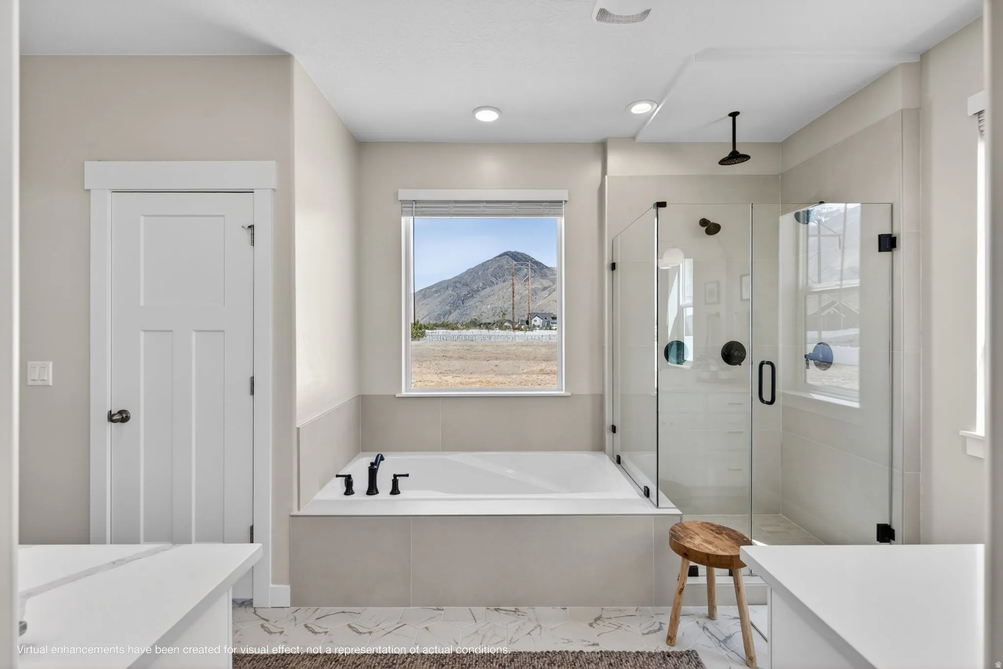 Bathroom featuring a mountain view, a stall shower, a garden tub, and vanity