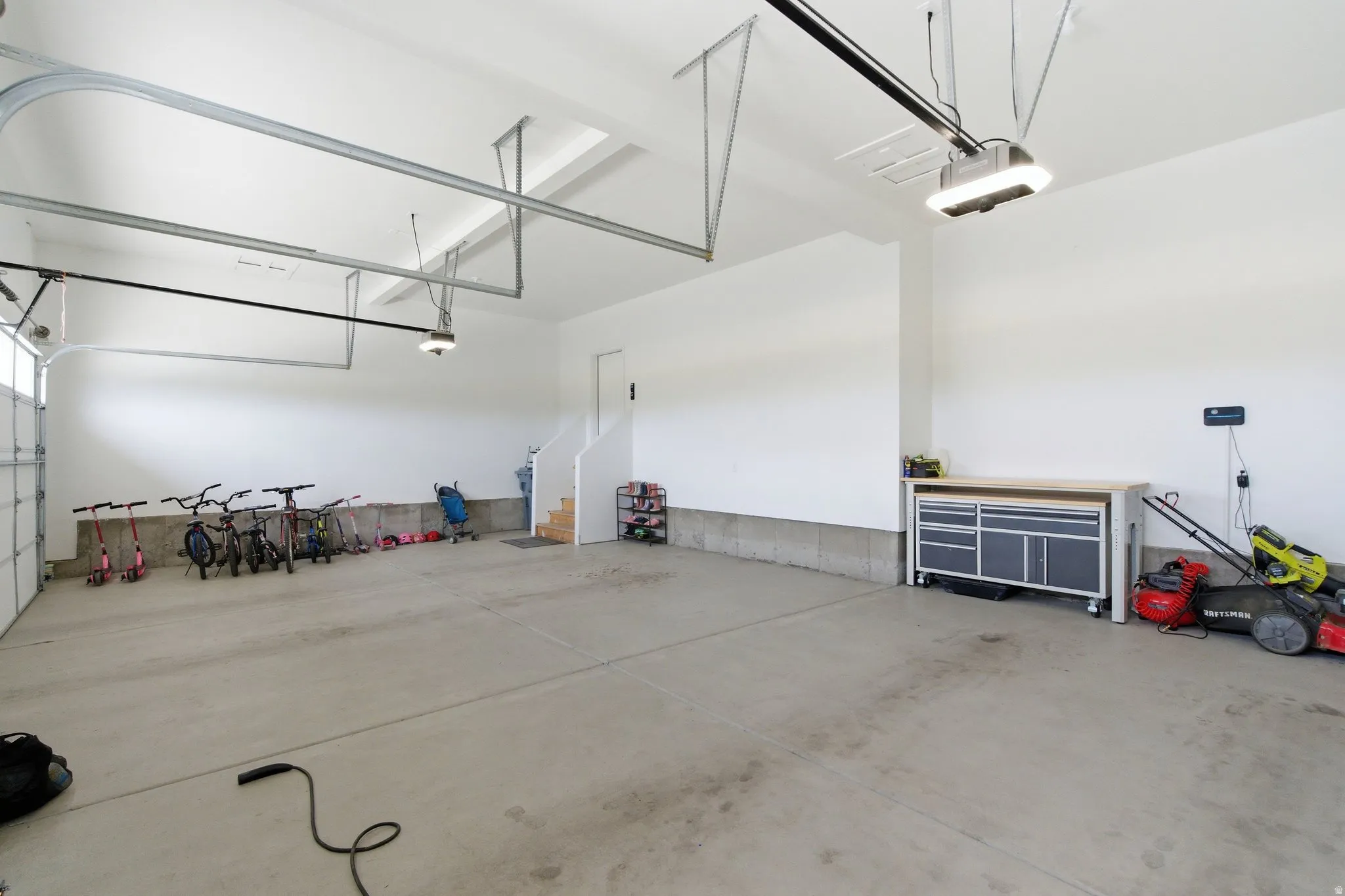 Garage featuring a garage door opener