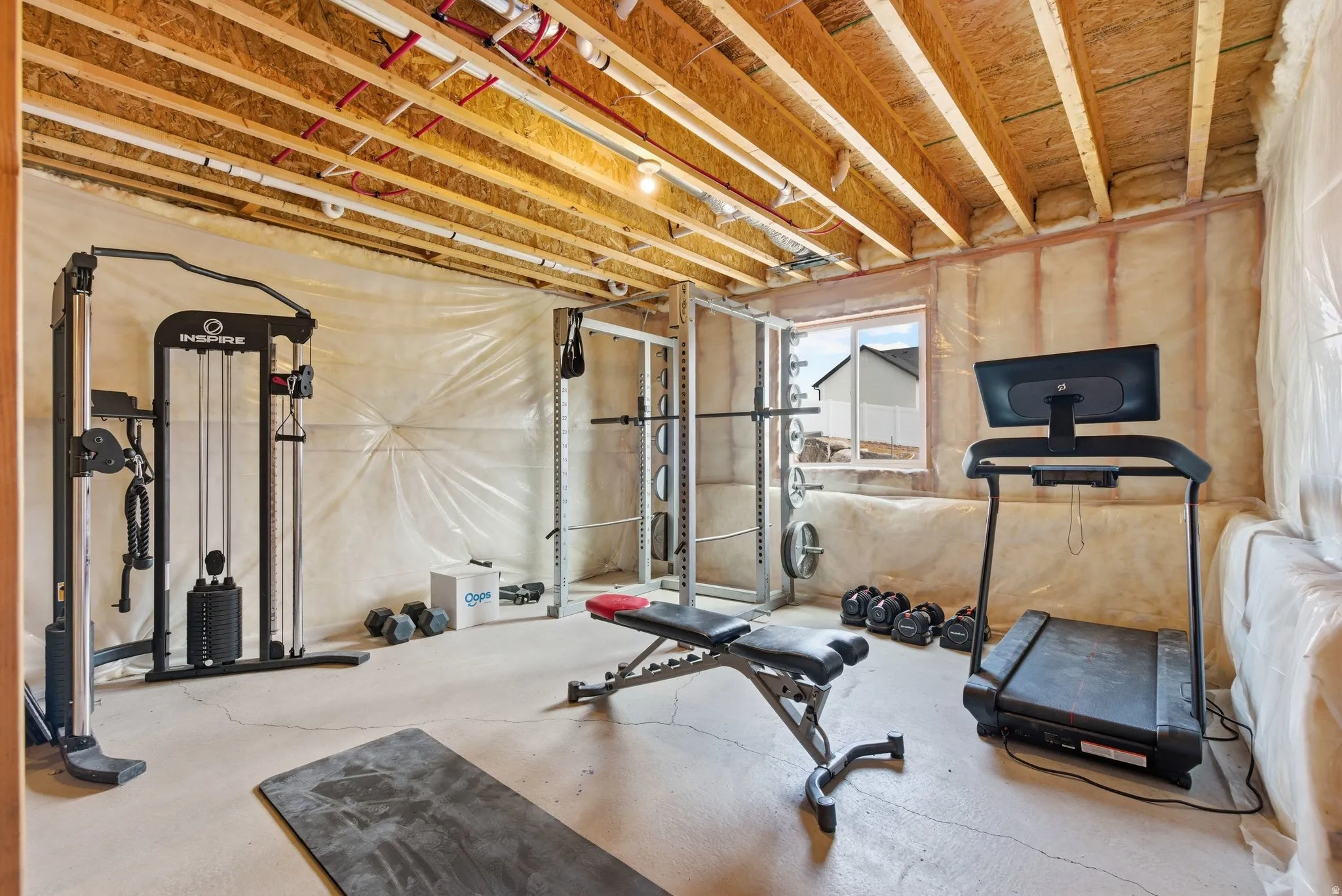 Workout area featuring concrete flooring