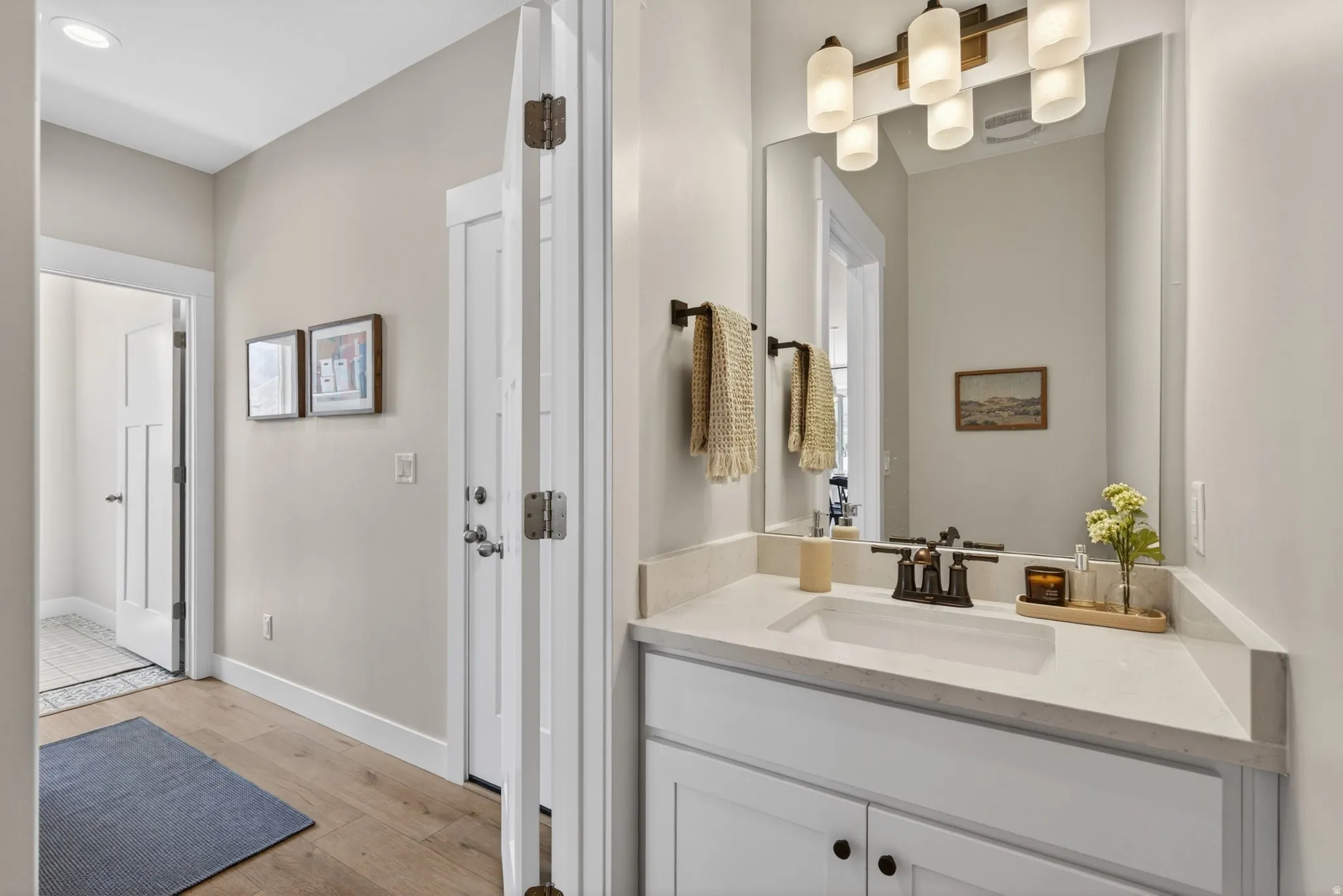 Bathroom with vanity and light wood-type flooring