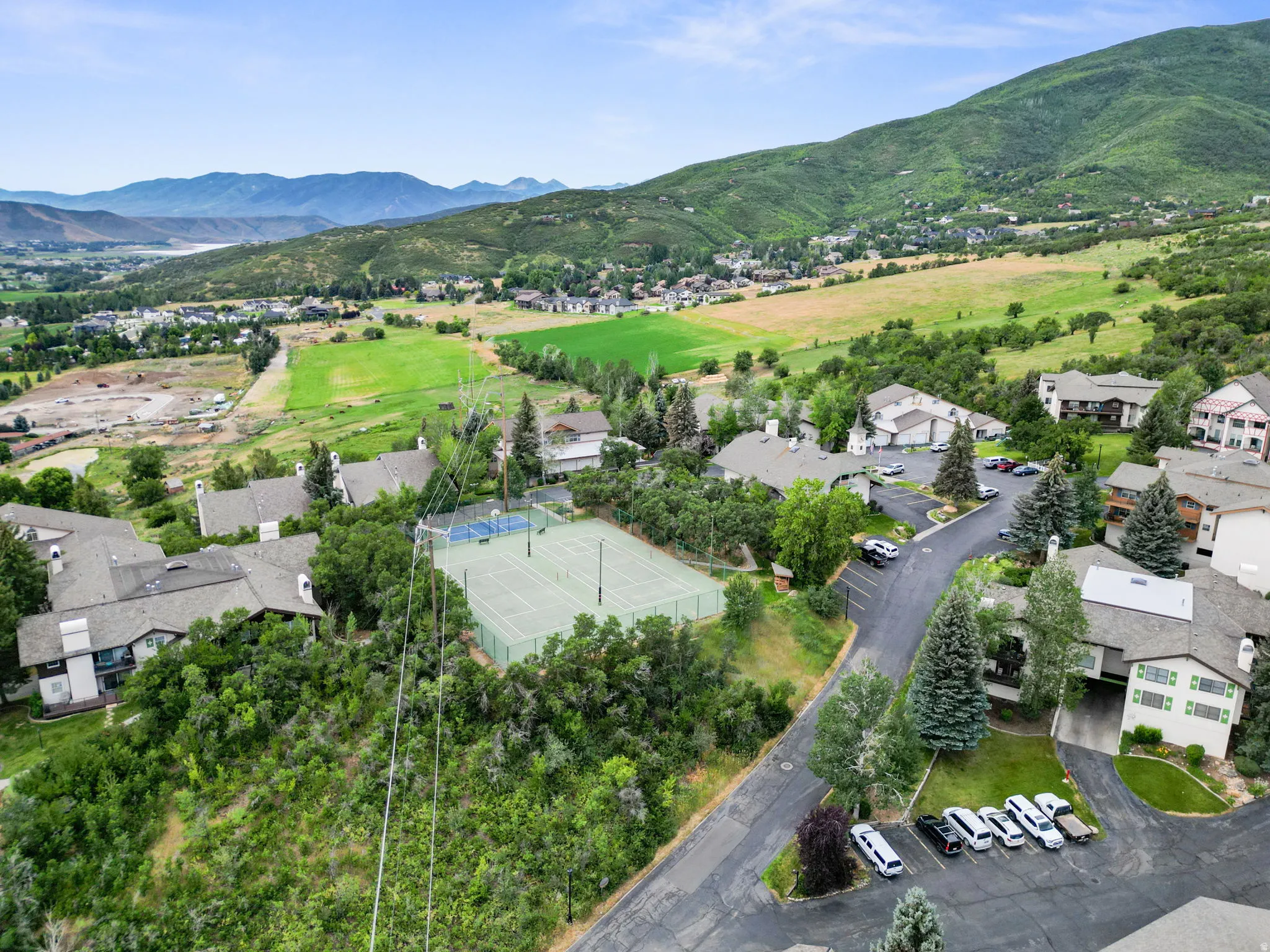 Aerial view of residential area featuring a mountainous background