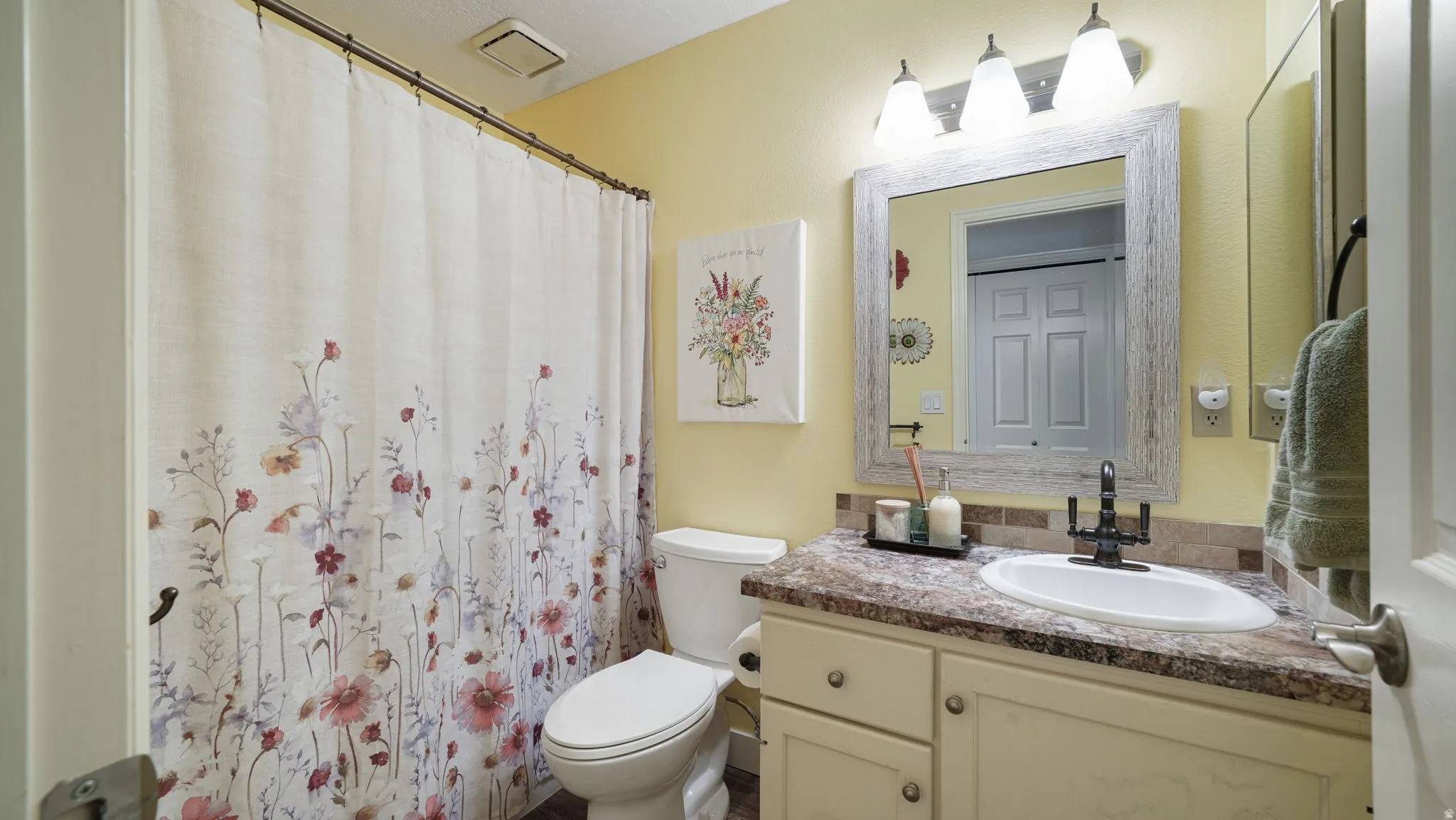 Bathroom featuring vanity and a shower with curtain