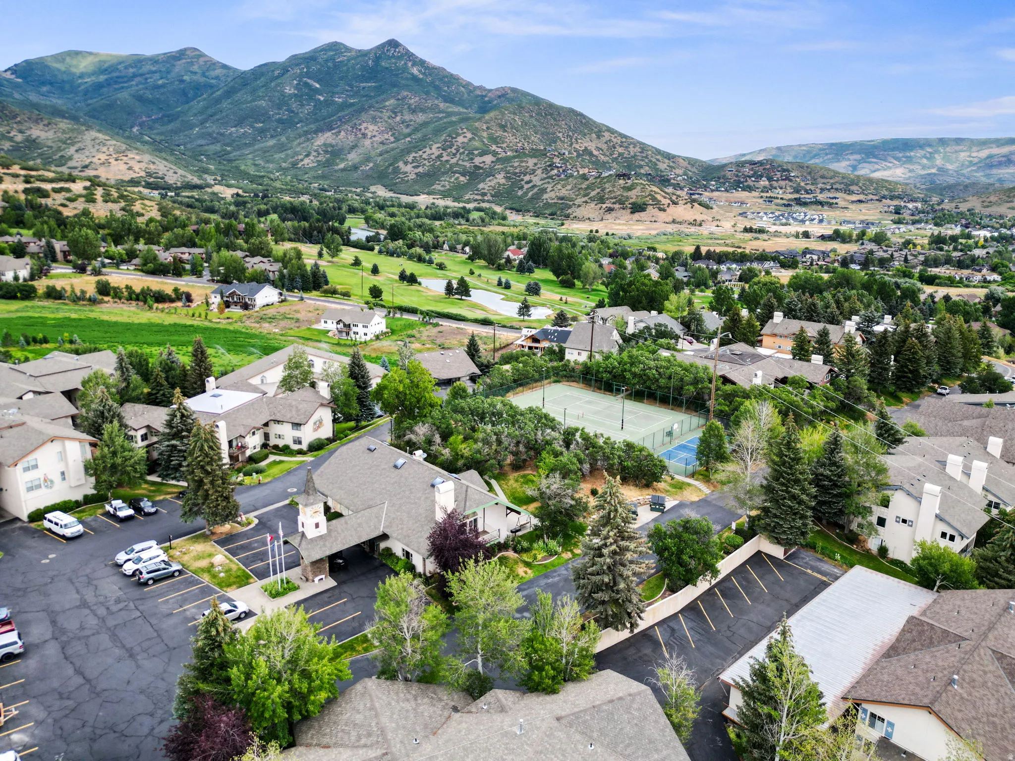 Aerial view of residential area featuring a mountain backdrop