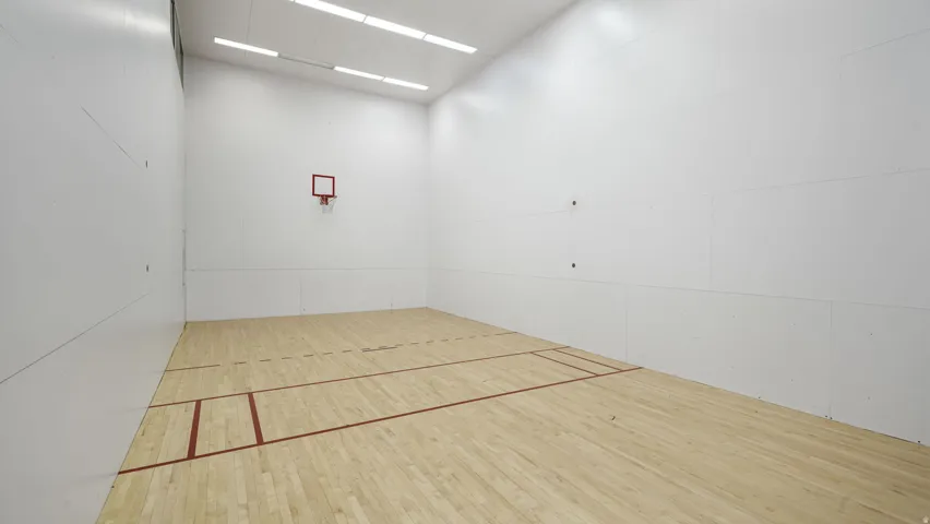Surrounding community featuring a sport court and community basketball court