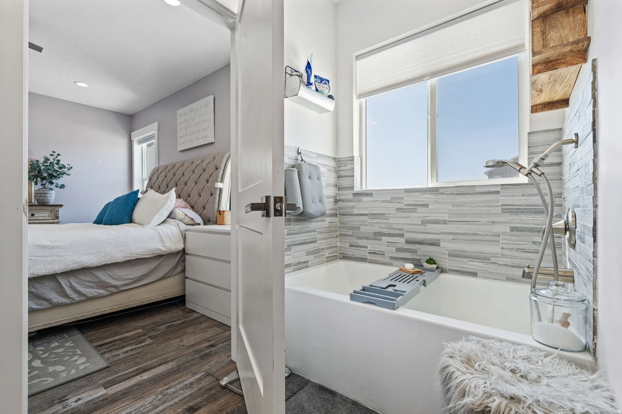 Bathroom with ensuite bath, dark wood-type flooring, and shower / tub combination
