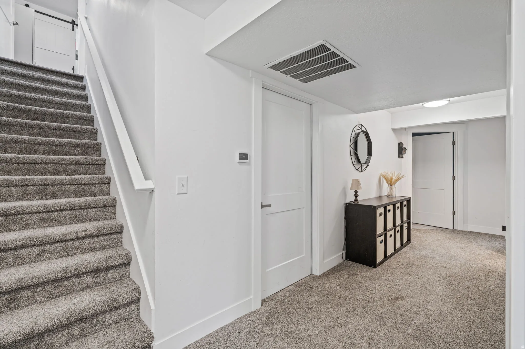 Stairs with baseboards and carpet