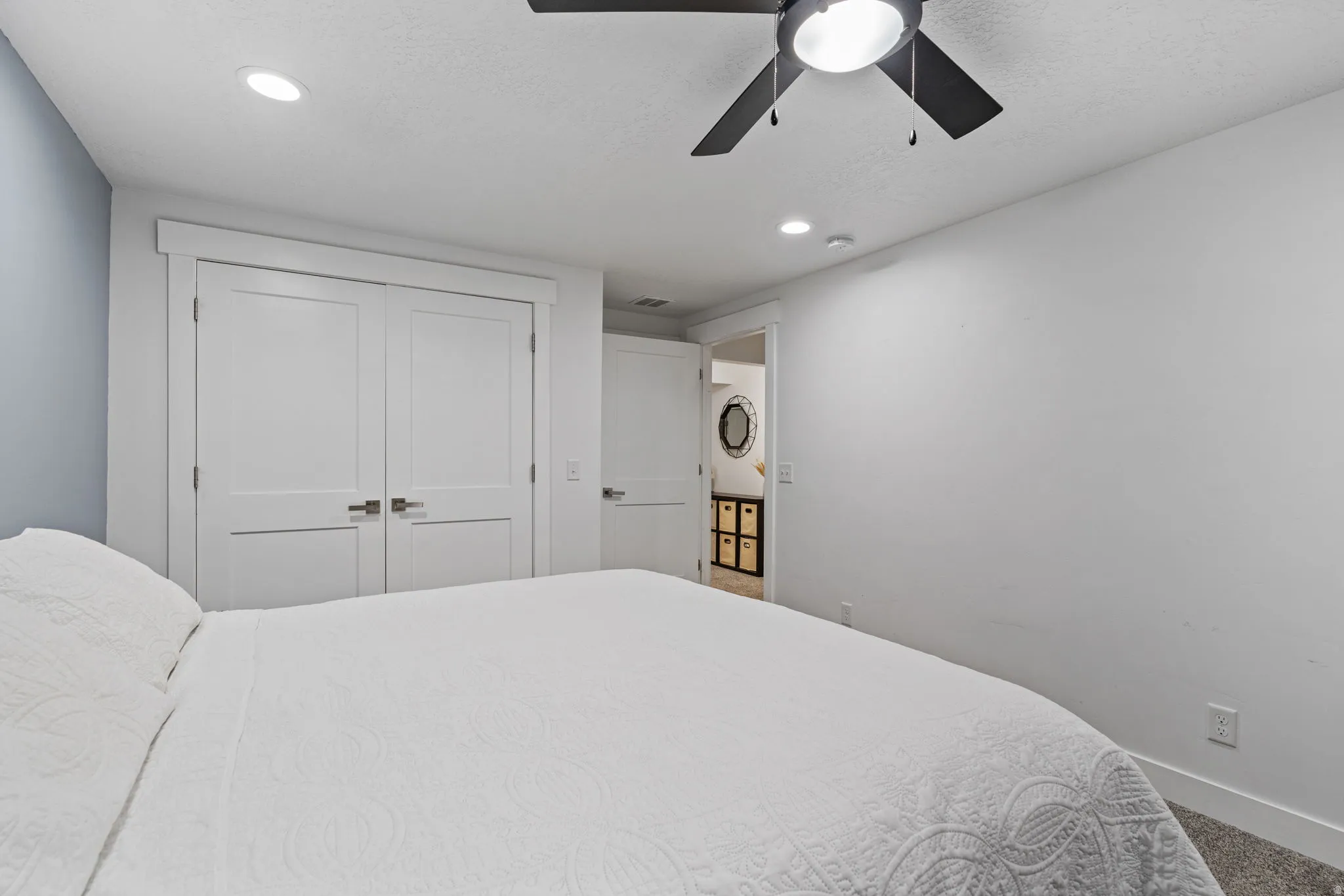 Bedroom featuring recessed lighting, a ceiling fan, and a closet