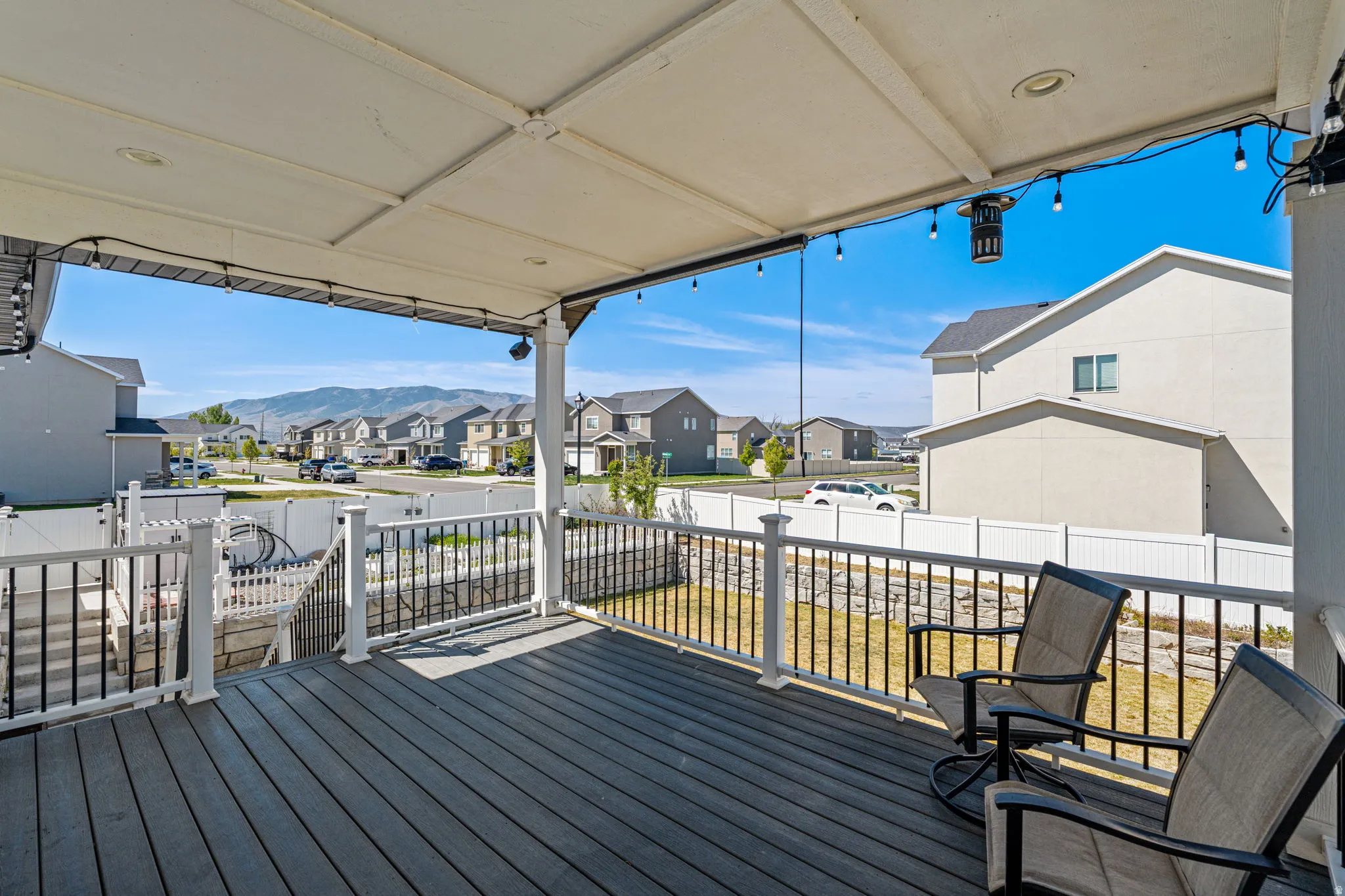 Deck with a residential view and a fenced backyard