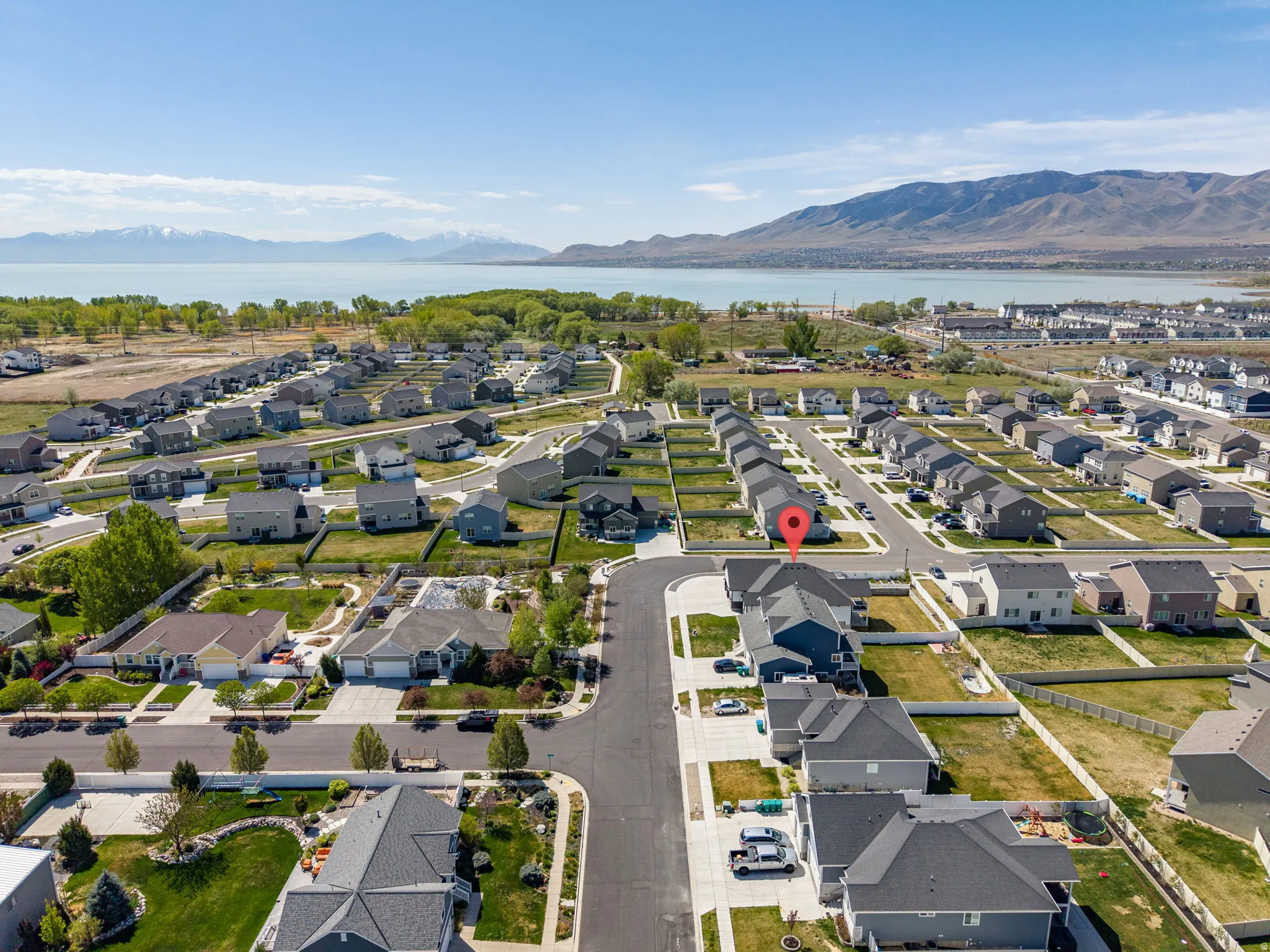 Aerial perspective of suburban area featuring a water and mountain view