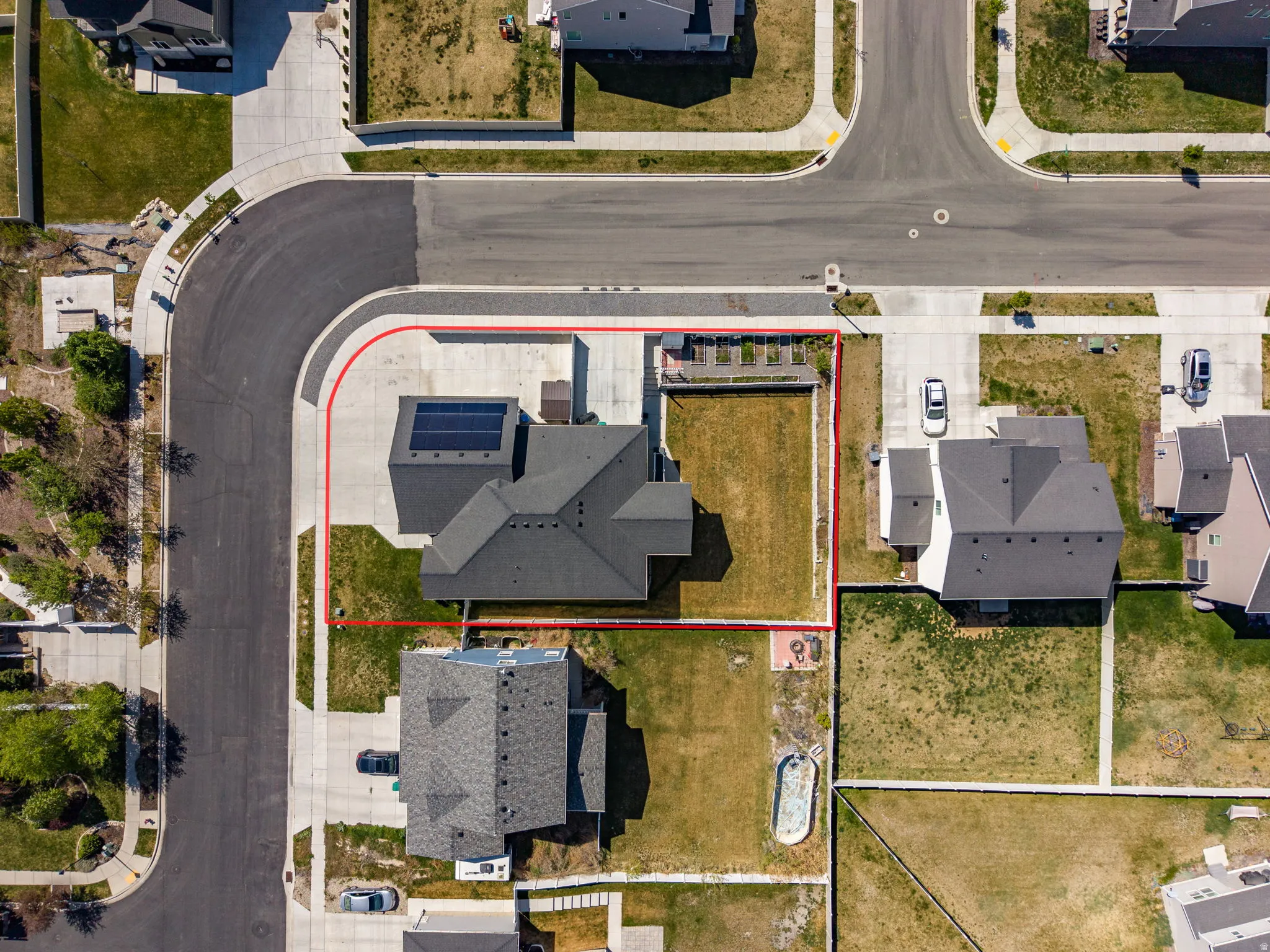 Aerial view of residential area with property boundaries highlighted