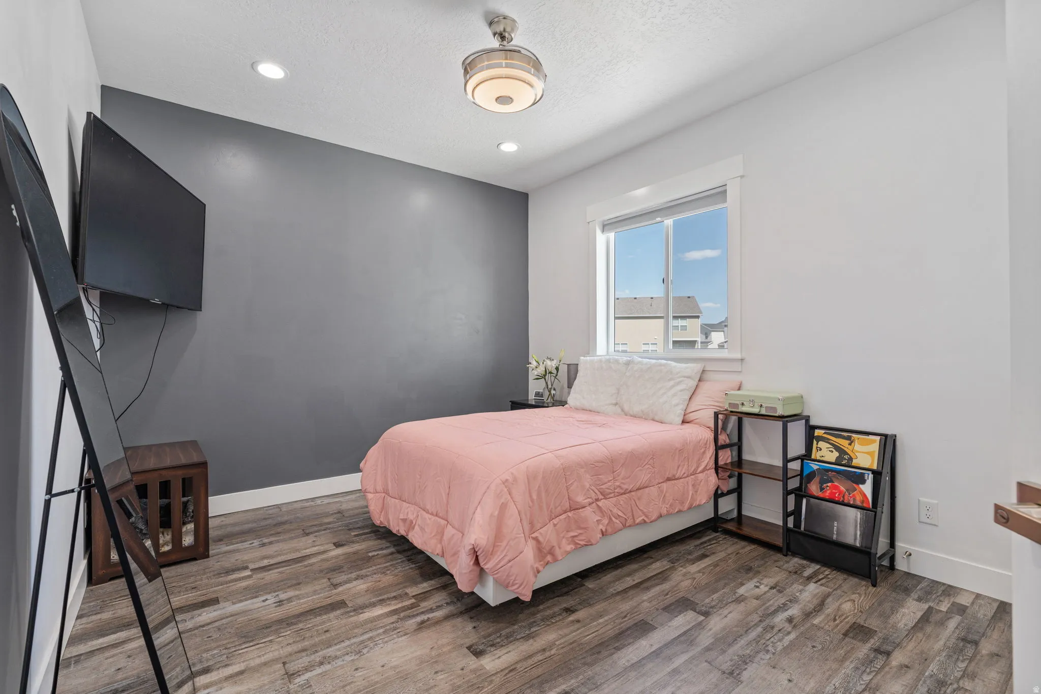 Bedroom featuring dark wood-style flooring, recessed lighting, and a textured ceiling