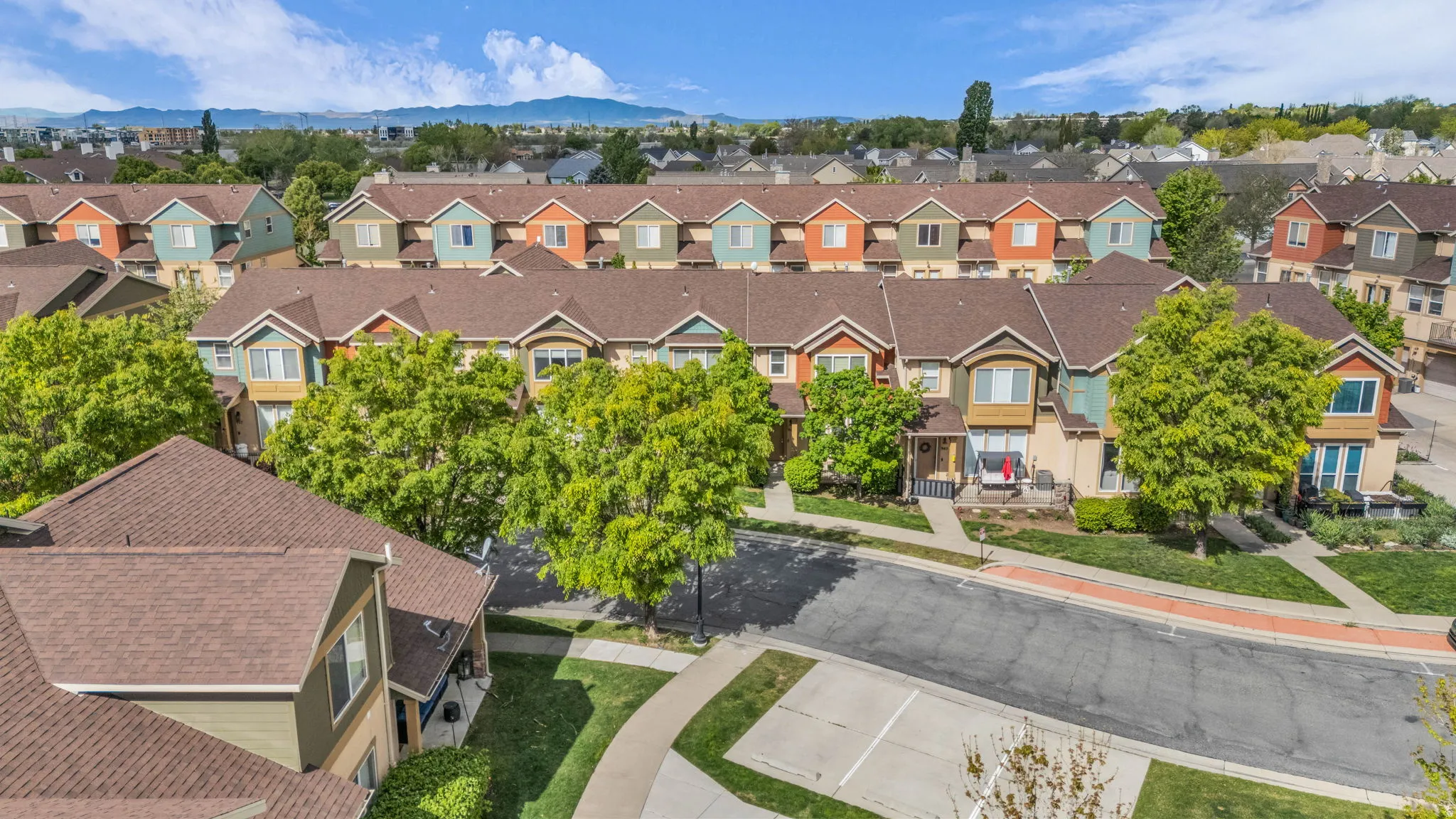 Aerial view of residential area featuring mountains