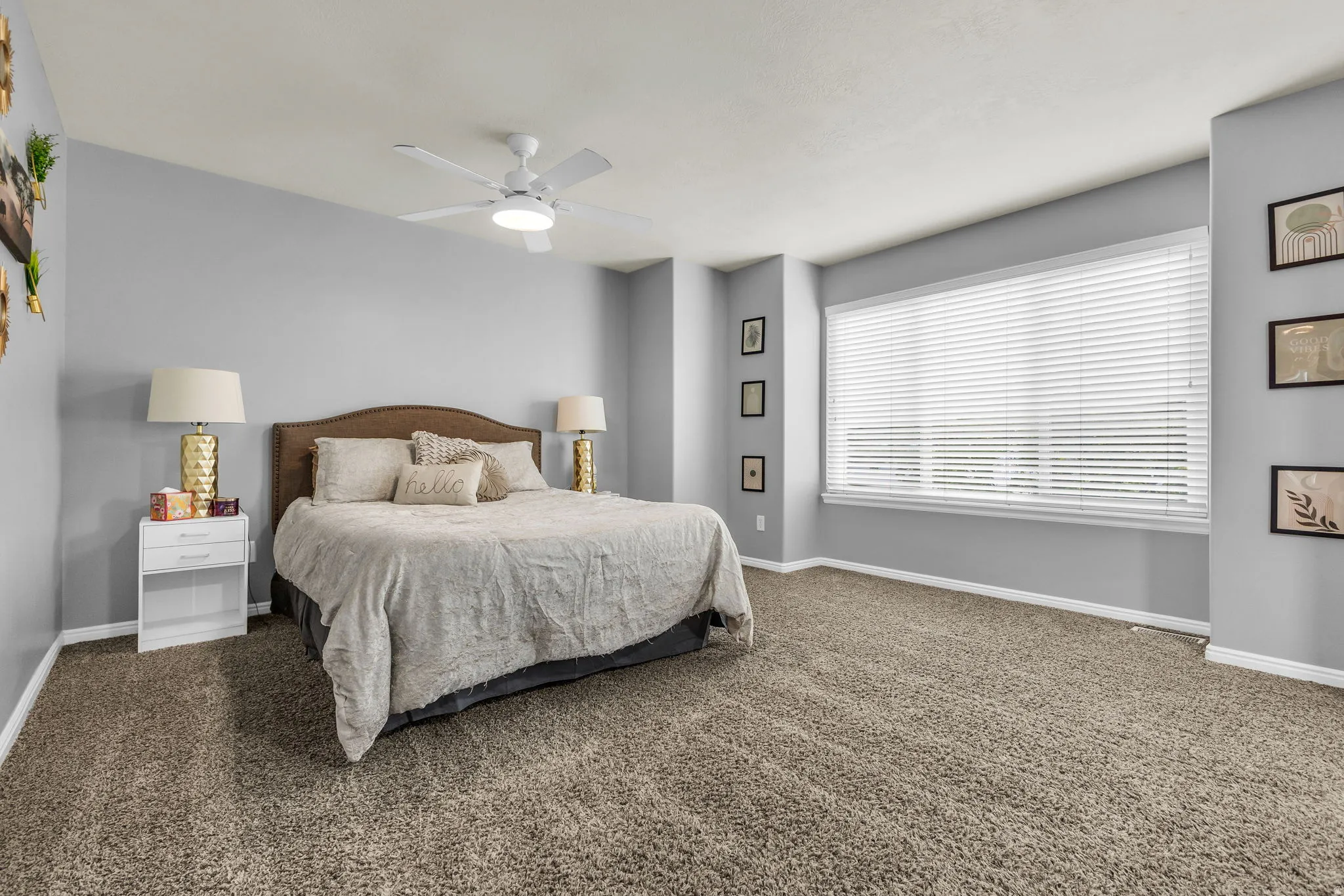 Bedroom with ceiling fan and carpet floors