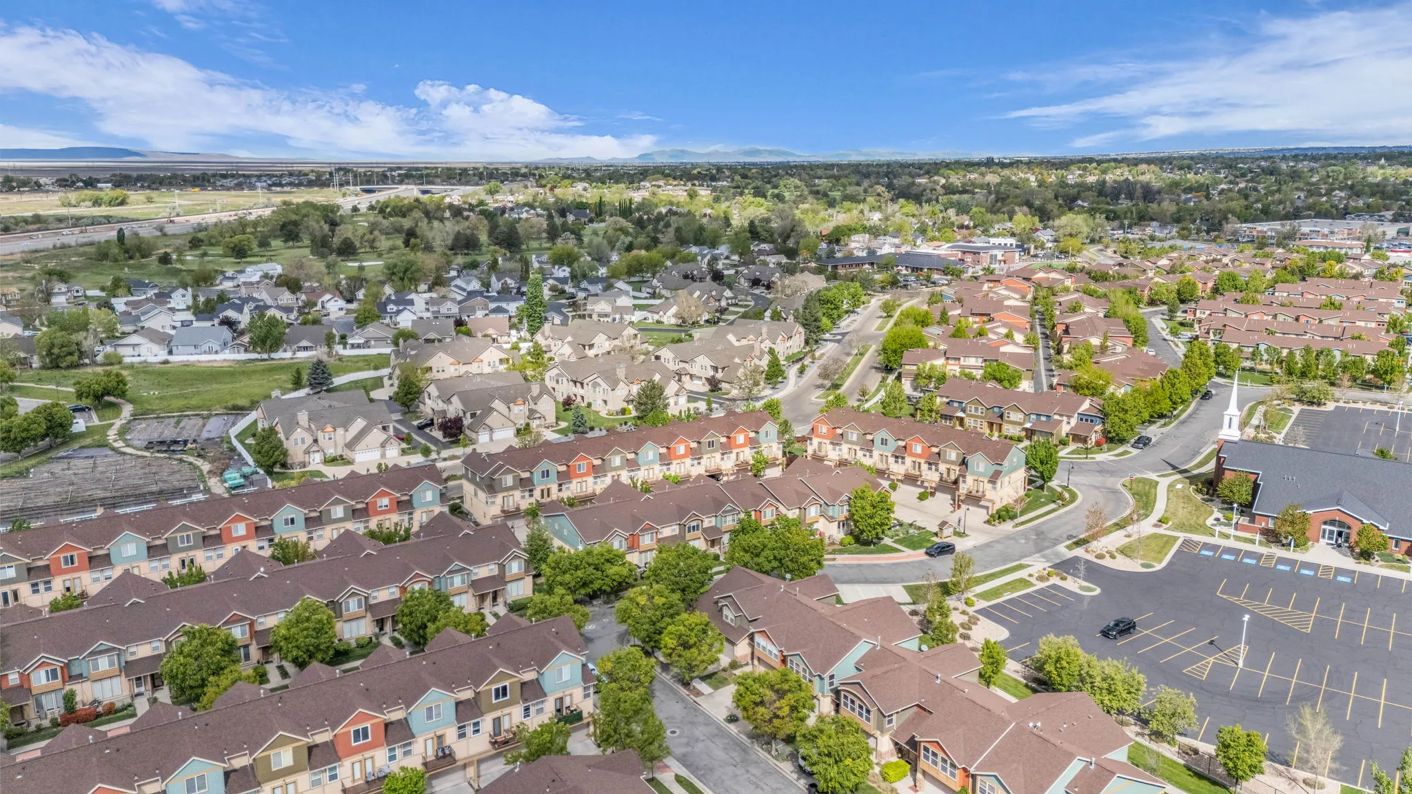 Aerial overview of property's location with nearby suburban area