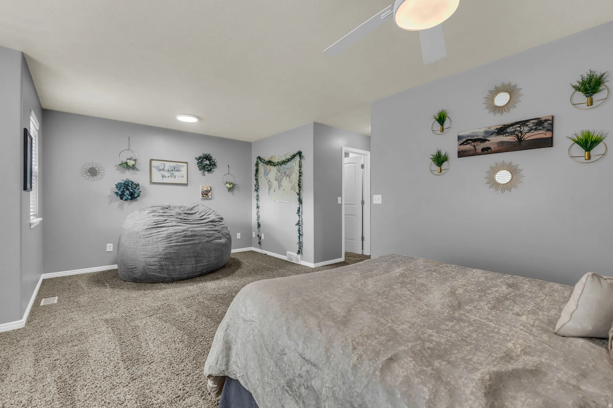 Bedroom featuring carpet flooring and a ceiling fan