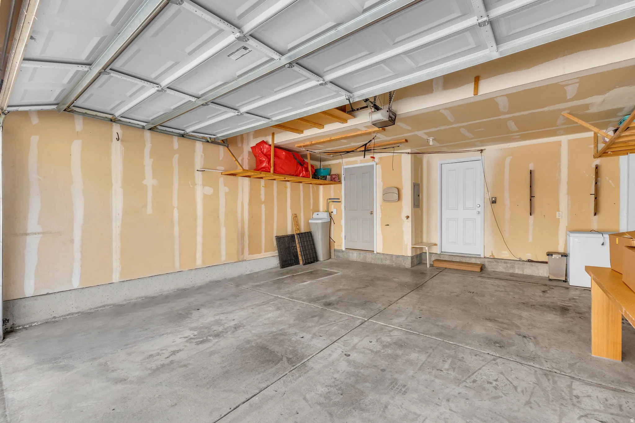 Garage featuring white fridge