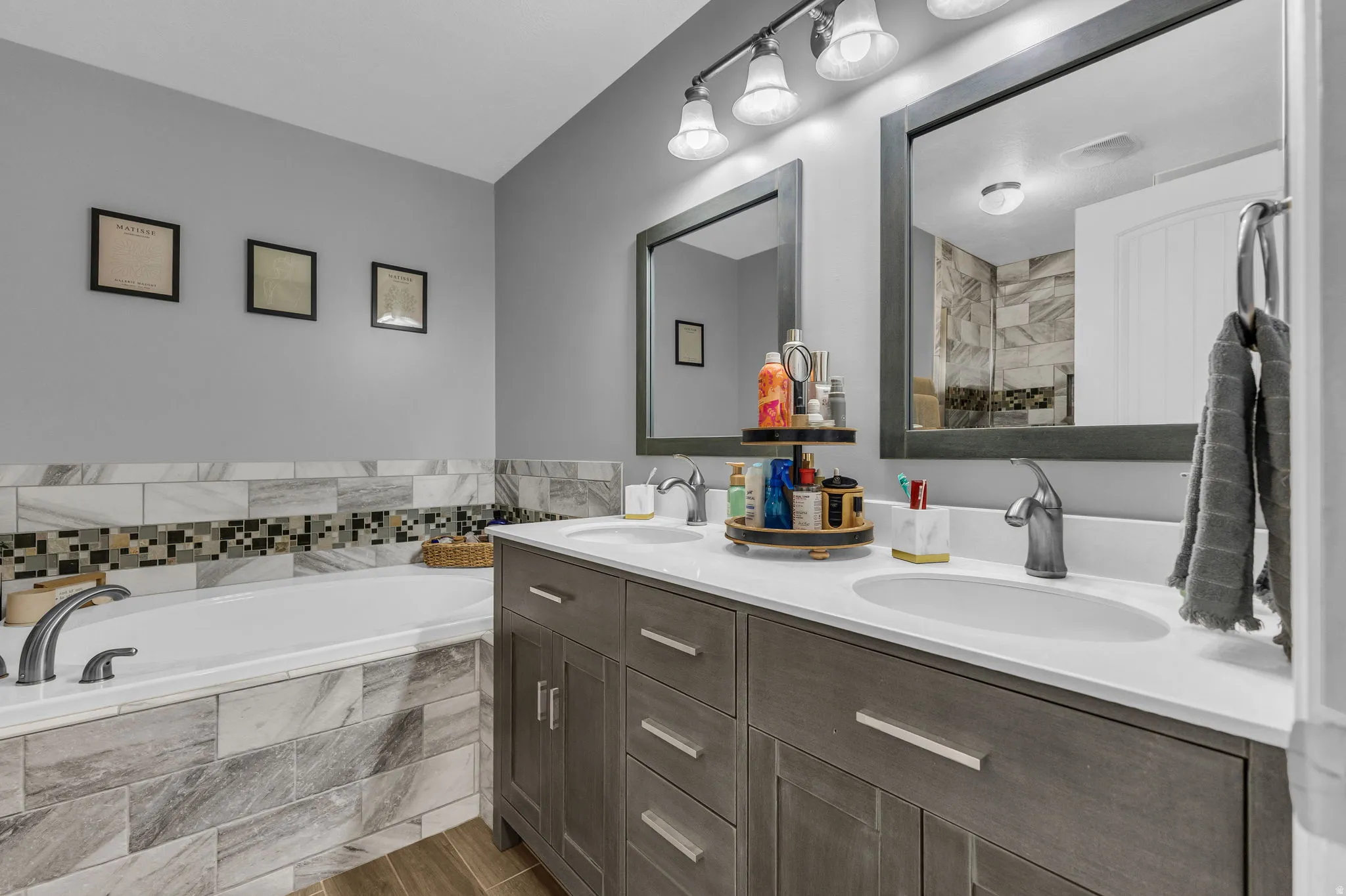 Bathroom with double vanity and a bath
