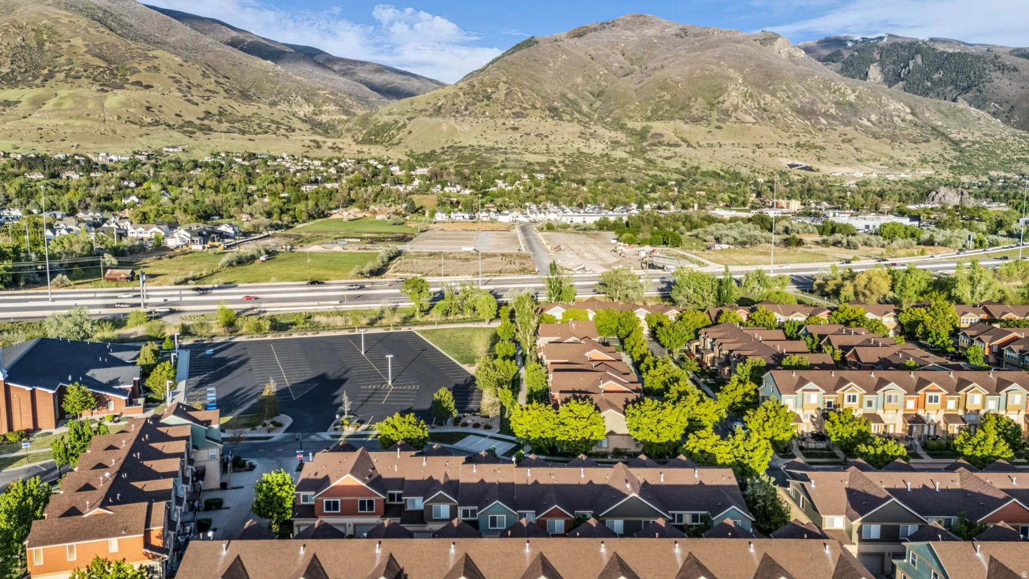 Aerial view of residential area featuring mountains