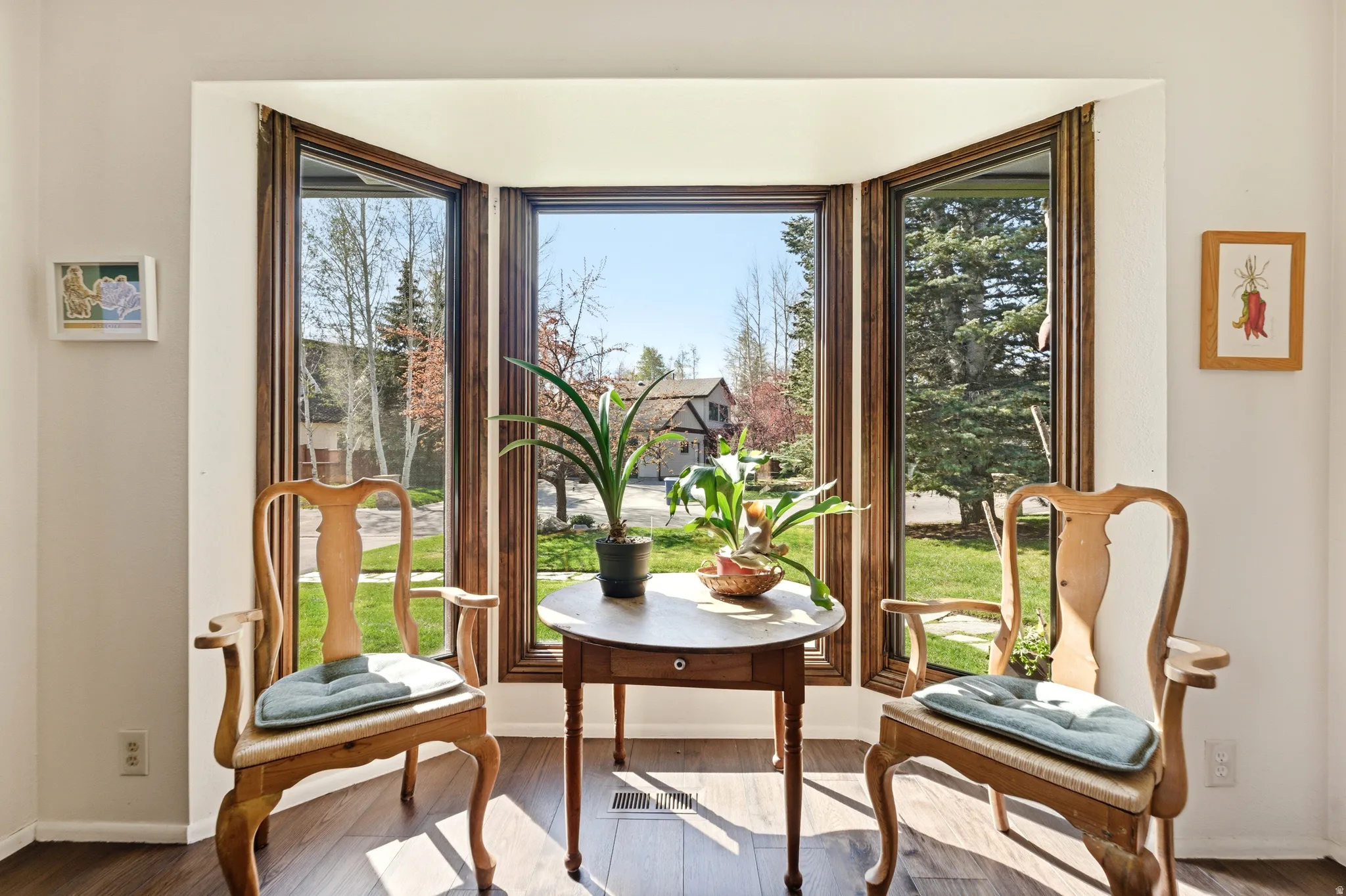 Doorway to outside with wood-type flooring and healthy amount of natural light