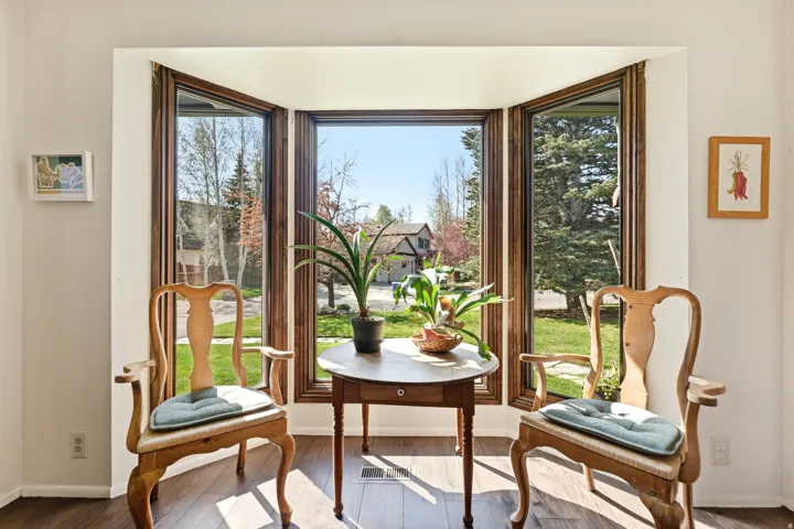 Doorway to outside with wood-type flooring and healthy amount of natural light