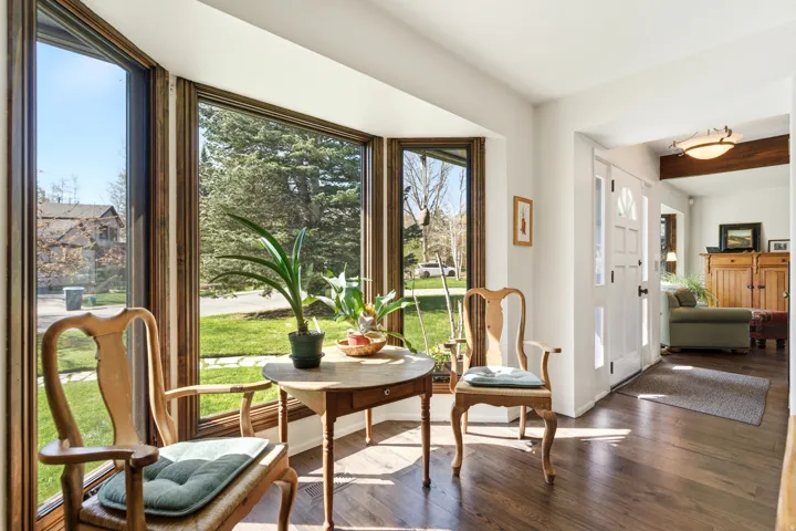 Sitting room featuring dark wood-type flooring