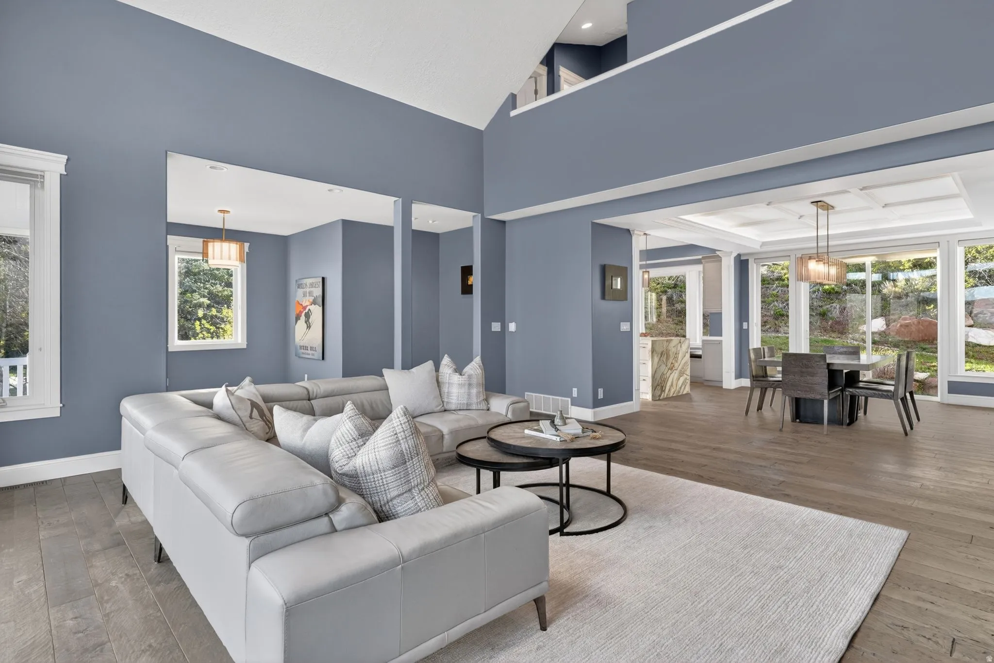 Living room with hardwood / wood-style flooring and lofted ceiling