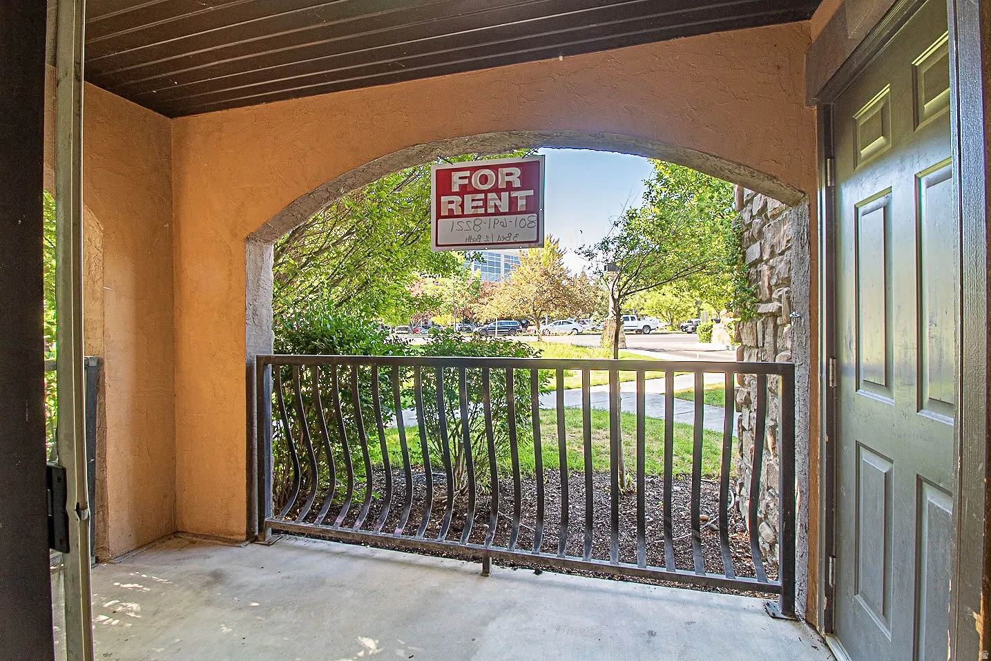 Doorway to property with stucco siding