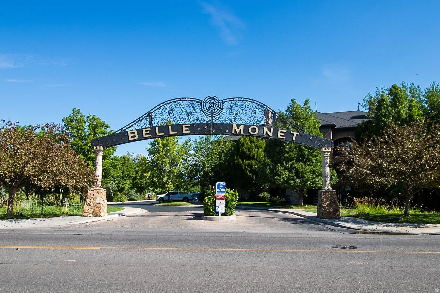 View of asphalt street featuring sidewalks and curbs