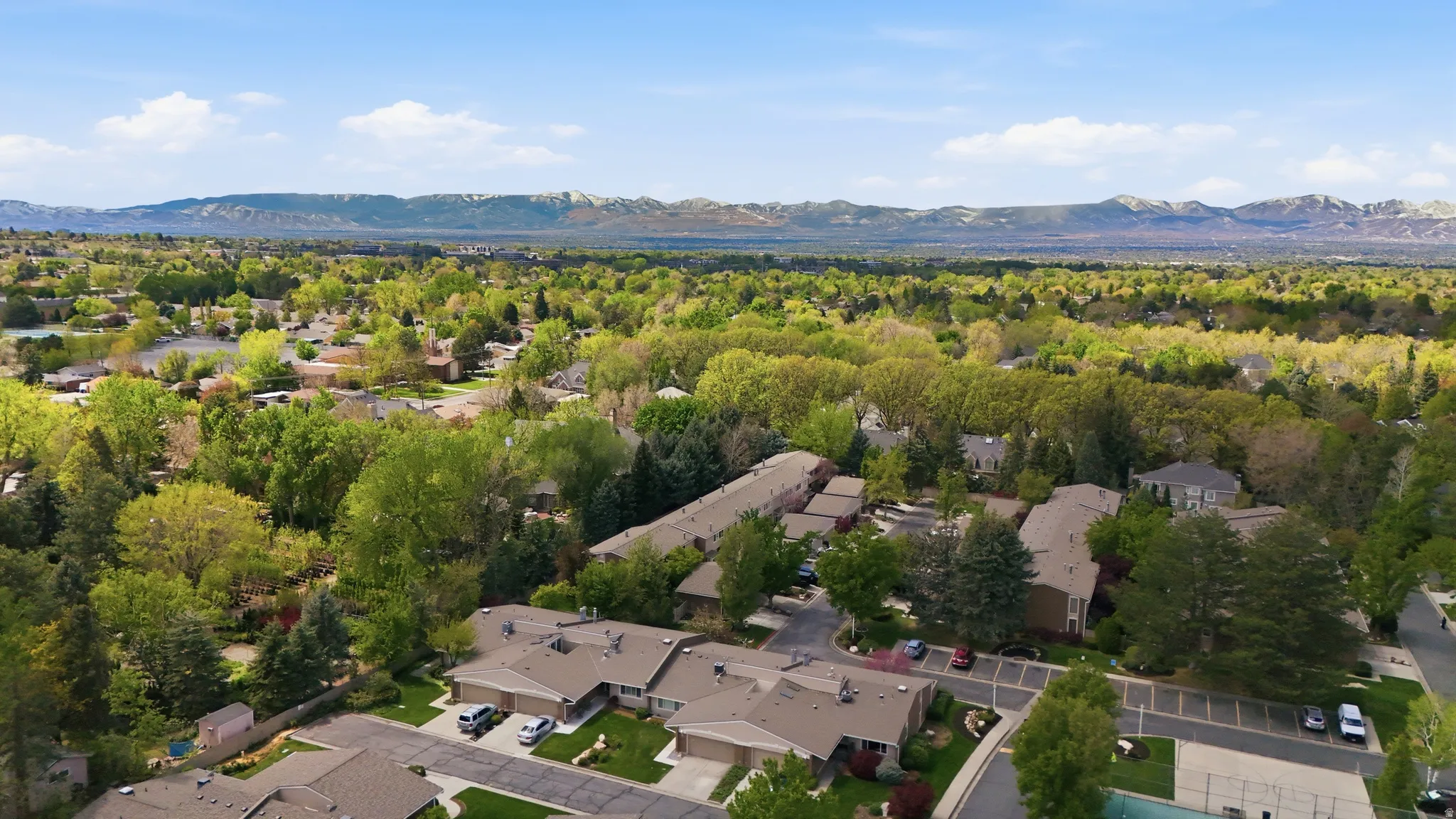 Aerial view of residential area featuring mountains