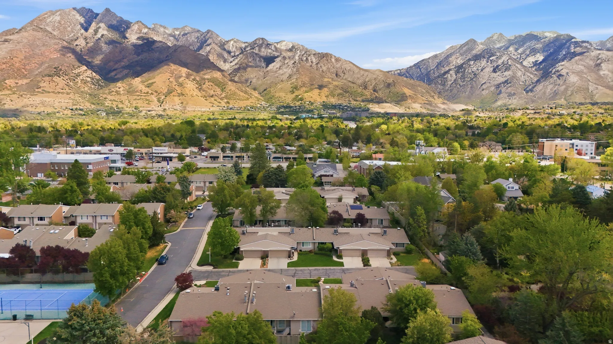 Aerial view of residential area with a mountainous background