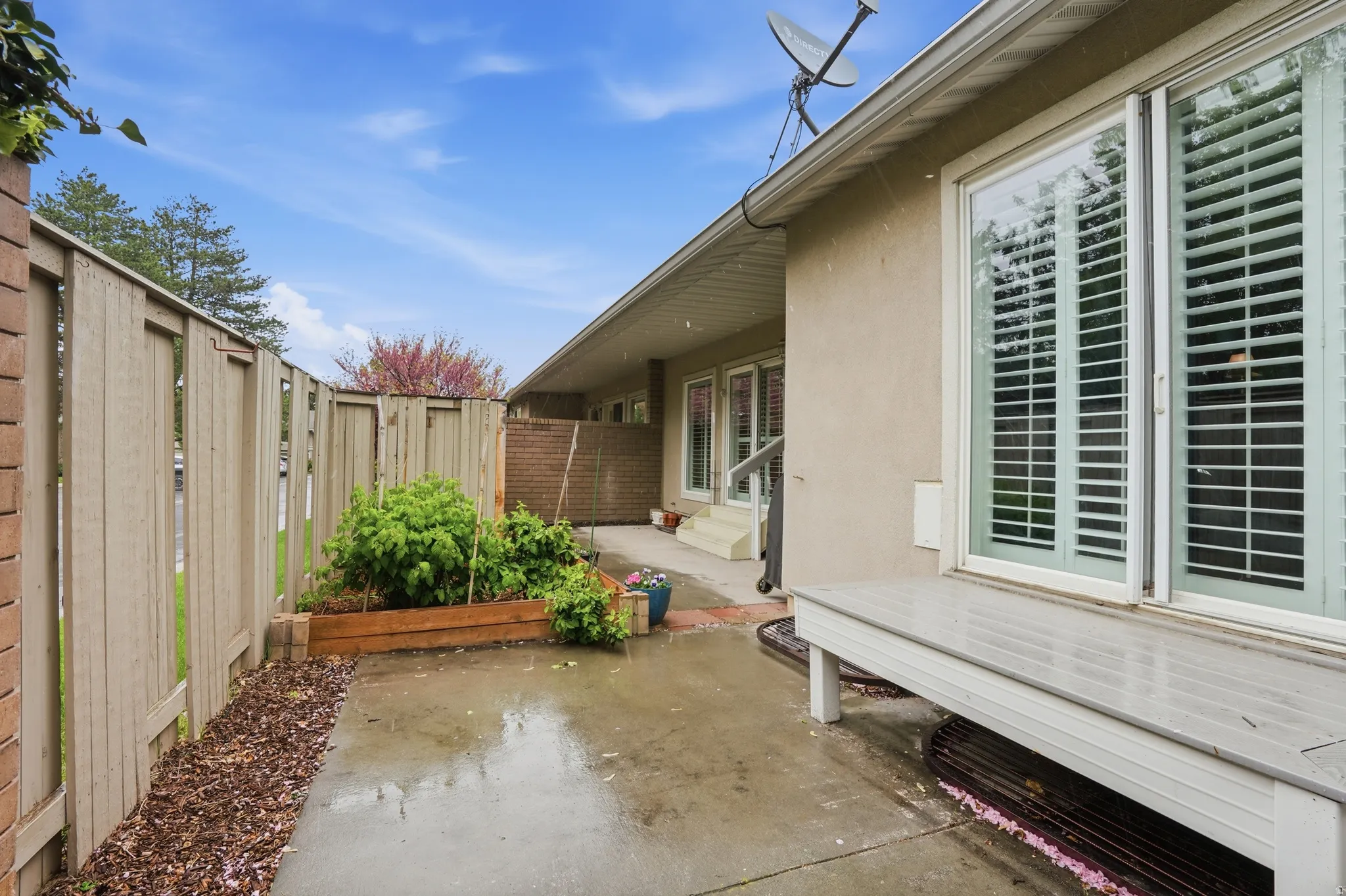 Fenced backyard featuring a patio and entry steps