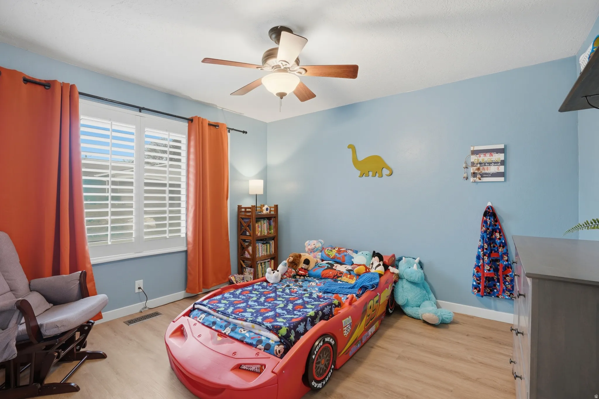 Bedroom featuring light wood-type flooring and a ceiling fan