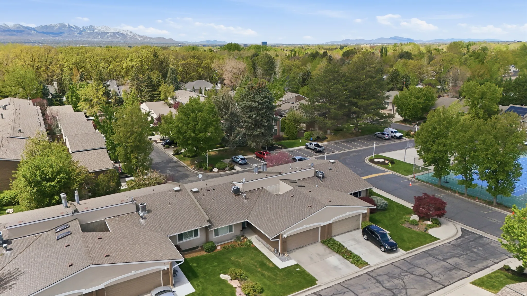 Aerial perspective of suburban area with a mountain backdrop