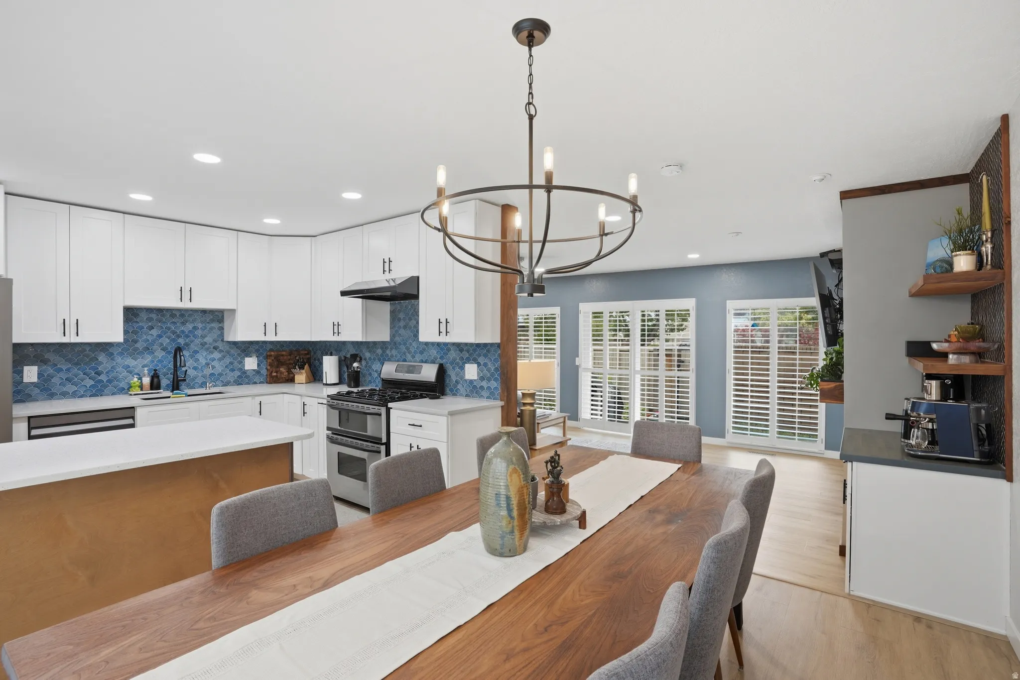 Dining area with a chandelier and light wood-type flooring