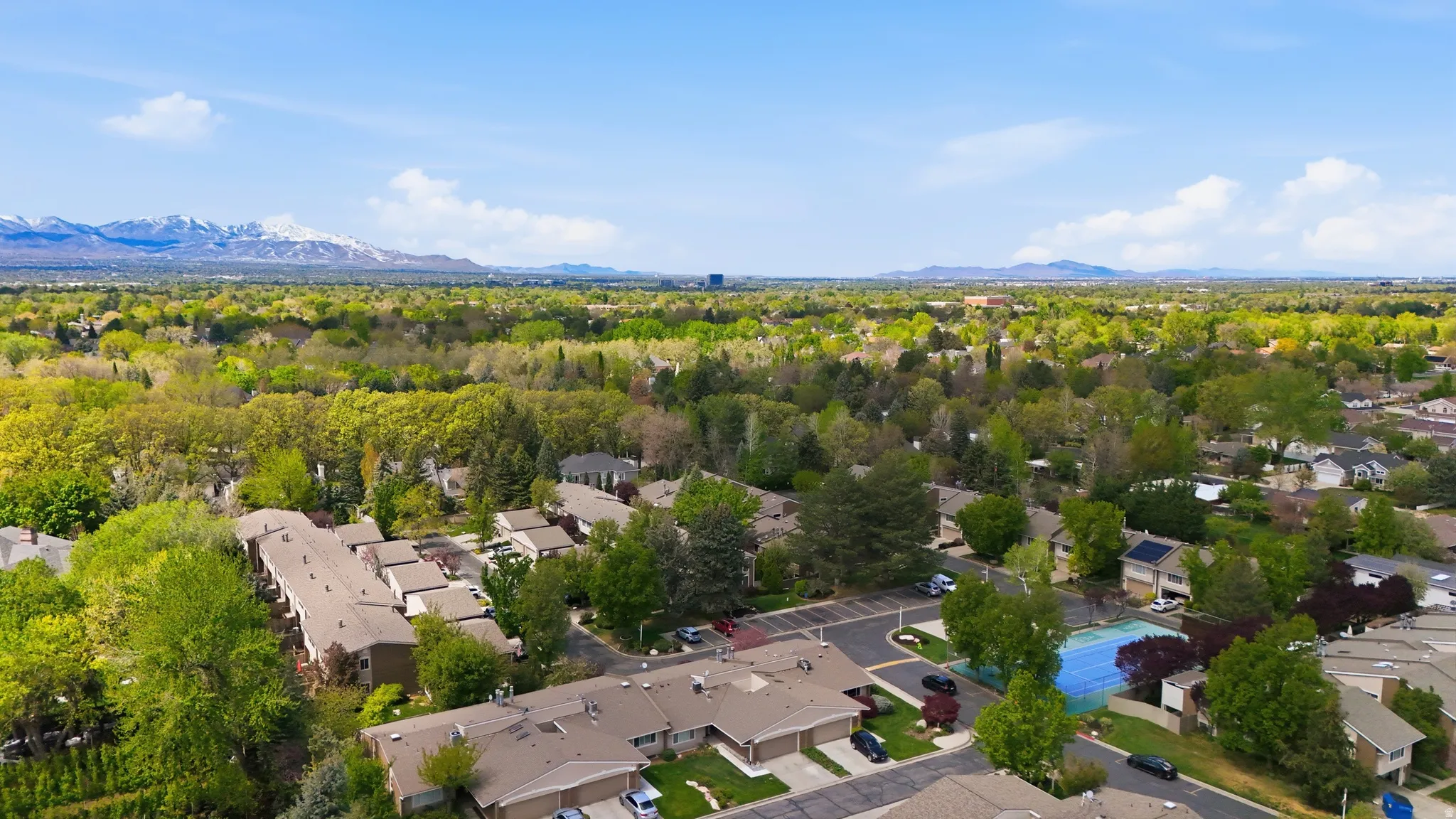 Aerial view of residential area with a mountain backdrop