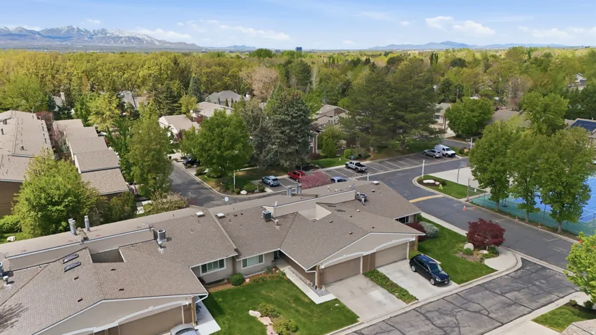 Aerial perspective of suburban area with a mountain backdrop